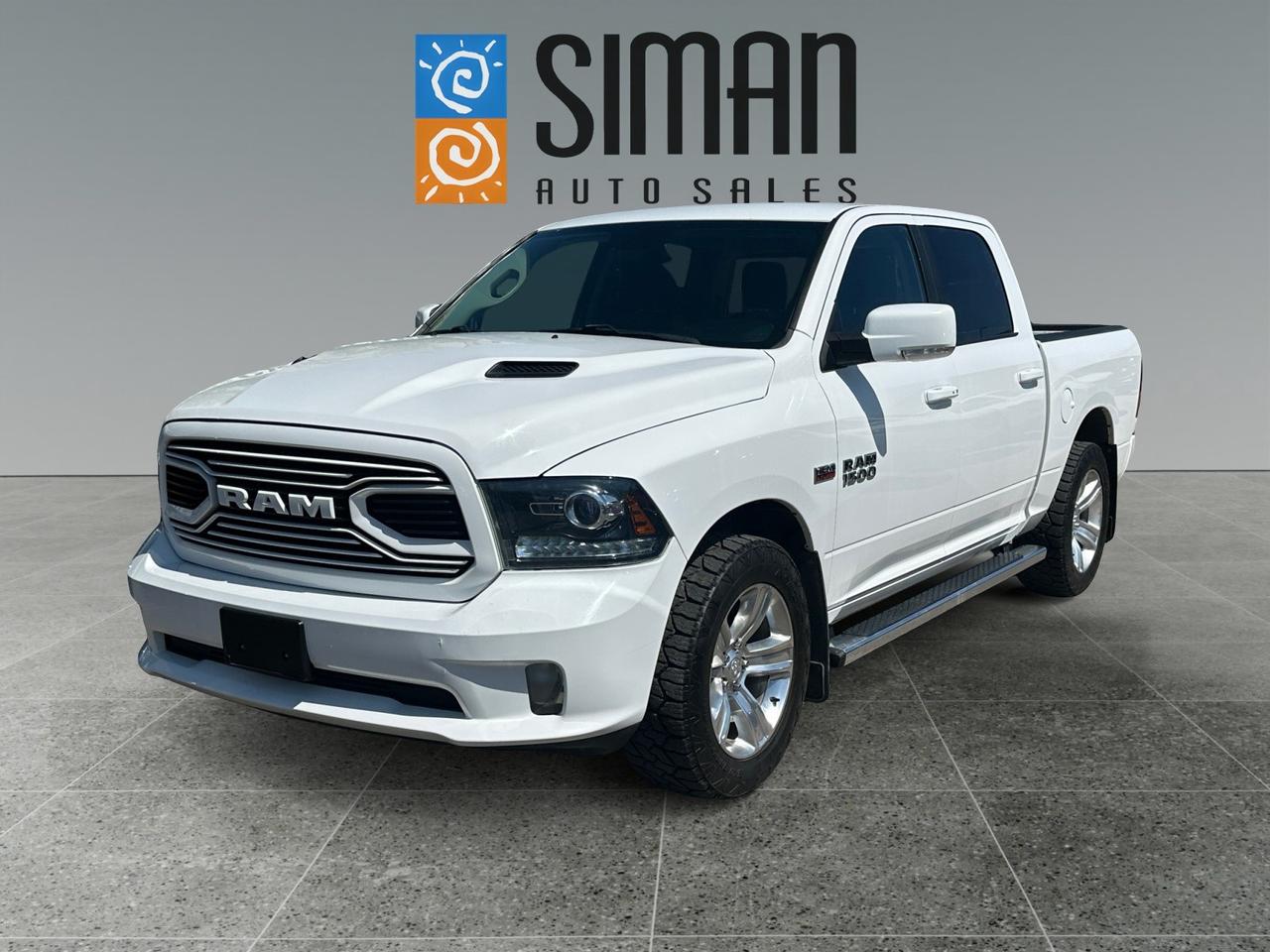2018 RAM 1500 SPORT - BRIGHT WHITE
Vehicle Highlights
This 2018 Ram 1500 Sport, in a clean Bright White finish, is a meticulously maintained, accident-free truck that combines powerful performance with premium comfort features. Equipped with the Sport Performance Hood, a Class IV Hitch Receiver, and a 3.92 Rear Axle Ratio, its built for both work and play. The interior features the Comfort and Convenience groups, including Remote Start and a Parkview Rear Back Up Camera, making every drive a pleasure. This vehicle has undergone a complete pre-sale inspection and a fresh full synthetic oil service, and it is ready for its next owner.

Key Features & Installed Options
[DFK] Transmission: 8-Speed Torqueflite Automatic: Delivers a seamless and efficient driving experience with optimal power delivery.

[26L] Quick Order Package 26L Sport: A comprehensive package that includes the Sport appearance and performance features.

[DMHA] 3.92 Rear Axle Ratio: Provides enhanced torque and towing capabilities for heavy loads and responsive acceleration.

[PW7] Bright White Monotone Paint Application: A clean, classic exterior look that highlights the trucks bold design.

[AJX9] Black, Sport Mesh Cloth/Vinyl Front Bucket Seats: Durable, stylish, and comfortable seating perfect for both daily commutes and long trips.

[AGF] Comfort Group: Adds key comfort features like heated seats and a heated steering wheel.

[ADC] Convenience Group: Includes a range of features designed to make driving easier and more pleasant.

Remote Start & Security Alarm Group: Start your truck from a distance for a pre-warmed cab and enjoy added security.

Class IV Hitch Receiver: Ready for towing with a factory-installed, high-capacity hitch.

[MGB] Sport Performance Hood: An aggressive, functional hood that enhances the trucks athletic aesthetic.

Parkview Rear Back Up Camera: Provides a clear view of the area behind the truck, making parking and hitching up trailers safe and simple.

Vehicle Condition & History
Carfax Report: Accident-free.

Pre-Sale Inspection: Complete and passed.

Service: Fresh full synthetic oil service performed.

Siman Auto Sales Advantage
Easy Financing: We offer easy on-site financing to fit your budget.

Trades Encouraged: We welcome your trade-in and offer fair pricing.

Aftermarket Warranties: A wide range of warranty options available to fit every need and budget.

Trusted in Regina: Serving the community for 26 years. Were large enough to make a difference and small enough to care.

Check Our Reviews: See what our satisfied customers have to say about their experience!