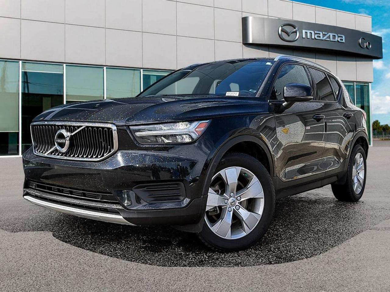 Experience luxury, performance, and advanced safety with this pre-owned 2020 Volvo XC40 Momentum T5 AWD in sleek Black. Powered by a 2.0L turbocharged engine paired with an 8-speed automatic transmission and full-time all-wheel drive, it delivers a smooth, confident ride in all conditions.Inside, enjoy heated front comfort seats with 10-way power adjustment, a stunning 9-inch touchscreen with voice-activated audio controls, and premium high-performance sound. Cutting-edge safety features like lane departure prevention, forward collision mitigation, pedestrian impact prevention, and a full suite of airbags give you peace of mind on every drive.With smart technology such as automatic climate control, wireless audio streaming, and smartphone mirroring, plus practical amenities like a rearview camera, rear parking sensors, and a panoramic sunroof, this Volvo XC40 perfectly blends style, comfort, and utility.Ready for your next adventure or daily commute  schedule your test drive today and take home this sophisticated, well-equipped SUV!Go Mazda is an AMVIC licensed businessThis vehicle has been registered in the province ofQuébec