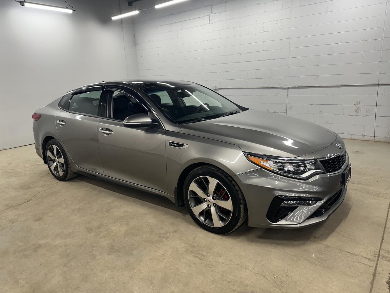 <p>Looking for a sleek and sporty sedan that offers both style and performance? Check out this stunning 2019 Kia Optima SX TURBO, available now at Troys Toys! This head-turning four-door sedan is finished in a sophisticated gray exterior, complemented by a luxurious black interior. Under the hood, youll find a powerful gasoline engine paired with an automatic transmission, delivering a smooth and responsive driving experience. With 158,215km on the odometer, this Optima SX TURBO has plenty of life left and is ready to hit the road with you.</p><p>The Kia Optima SX TURBO is packed with features designed to elevate your driving experience. Heres a taste of what awaits you:</p><ul><li><strong>Turbocharged Performance:</strong> Experience thrilling acceleration and exhilarating performance with the powerful turbocharged engine, making every drive an adventure.</li><li><strong>Sporty Styling:</strong> The SX TURBO trim boasts a sporty design with aggressive accents and premium touches that will make you stand out from the crowd.</li><li><strong>Luxurious Interior:</strong> Sink into the comfortable black interior, offering premium materials and a driver-focused design that will make you feel like royalty.</li><li><strong>Advanced Technology:</strong> Stay connected and entertained with the latest technology features, including a user-friendly infotainment system, keeping you in touch with the world while on the go.</li><li><strong>Safety Features:</strong> Drive with peace of mind knowing that this Optima SX TURBO is equipped with advanced safety features, designed to protect you and your passengers.</li></ul><p><strong><em>Powered by AutoIntelligence&trade;</em></strong> Vehicle information has been generated using artificial intelligence and is provided for informational purposes only. While efforts are made to ensure accuracy, please confirm all details directly with the dealer.</p>