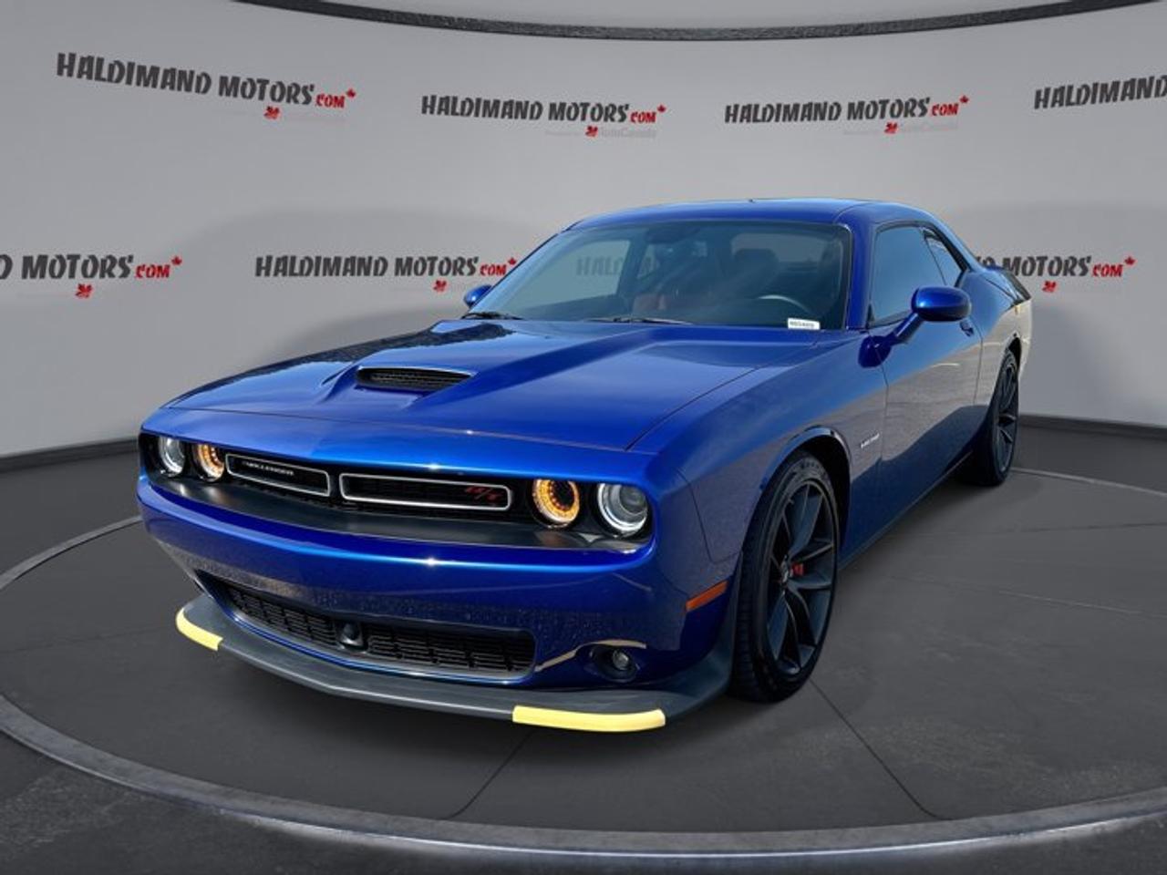 // ACCIDENT FREE!! //<br /><br />Turn every drive into an event with this 2022 Dodge Challenger R/T Plus Group from Haldimand Motors Ltd. in Cayuga. Finished in Blue with a Black interior, this two-door coupe pairs classic Dodge muscle car style with modern comfort, smart technology, and a confident V8 soundtrack.<br /><br />This used 2022 Dodge Challenger R/T Plus Group is powered by a 5.7-litre gas engine and paired with an automatic transmission for smooth, responsive performance. With only 27,285 km on the odometer, it delivers strong road presence, everyday usability, and the bold character drivers expect from a true Dodge performance coupe.<br /><br />The accident-free history adds extra peace of mind, while the Plus Group and Performance Handling Group bring sought-after upgrades for drivers who want more from every trip. Leather seats, ventilated front seats, dual-zone climate control, and ambient lighting help make this Challenger feel as rewarding inside as it is from behind the wheel.<br /><br />FEATURES OF THE Challenger R/T | No accidents | Leather Seats | Performance Handling Group and much more <br />   Ventilated front seats add welcome comfort<br />   Ambient lighting creates a premium cabin<br />   Auto-dimming mirror helps reduce nighttime glare<br />   Driver power seat adds tailored support<br /><br />ADVANCED SAFETY FEATURES<br />   Backup camera helps with reversing confidence<br />   Anti-lock braking system supports controlled stops<br />   Stability control enhances traction in corners<br />   Side and head airbags add protection<br /><br />PERFORMANCE AND EFFICIENCY<br />   5.7-litre V8 delivers classic Dodge power<br />   Automatic transmission provides smooth gear changes<br />   Limited slip differential improves rear traction<br />   Performance tires support sharper road feel<br /><br />COMFORT AND CONVENIENCE<br />   Dual-zone climate control keeps temperatures balanced<br />   Cruise control supports relaxed highway driving<br />   Push button start adds daily convenience<br />   Heated mirrors help in cold weather<br /><br />TECHNONOLGY AND CONNECTIVITY<br />   Apple CarPlay connects your favourite apps<br />   Android Auto keeps smartphone access simple<br />   Bluetooth integration supports hands-free communication<br />   Steering wheel audio controls ease adjustments<br /><br />CARGO SPACE<br />   Rear trunk access makes loading easier<br />   Coupe trunk handles everyday gear well<br />   Wide opening helps with larger items<br />   Practical space for weekend travel bags<br /><br />AWARDS & RECOGNITIONS<br />   Best Retained Value, Canadian Black Book, 2022<br /><br />WHAT OTHER OWNERS LIKE<br />   Strong V8 sound and smooth power<br />   Comfortable ride for daily driving<br />   Easy-to-use infotainment and phone connectivity<br />   Bold coupe styling with practical comfort<br /><br />This Challenger stands out with a rear spoiler, fog lights, automatic headlights, power windows, power steering, electric mirrors, and rear window defroster. Driver-focused details such as an adjustable steering wheel, leather-wrapped steering wheel, lumbar support, and illuminated vanity mirrors help make every trip more enjoyable.<br /><br />This Dodge also includes tire pressure monitoring, automatic door locks, passenger airbag sensor, front air conditioning, and a clean, focused cabin layout. The combination of classic muscle proportions, useful modern features, and low kilometres makes it an excellent choice for drivers who want excitement without giving up comfort and convenience.<br /><br />If you want a coupe that looks bold, sounds great, and delivers real V8 character, this 2022 Dodge Challenger R/T Plus Group deserves a close look. It offers the right mix of performance, comfort, and proven Dodge attitude, ready for its next owner here at Haldimand Motors Ltd. in Cayuga.<br /><br />This 2022 Dodge Challenger R/T | No accidents | Leather Seats | Performance Handling Group and much mores VIN is: 2C3CDZBTXNH116486.<br /><br />WHY CHOOSE US? <br /><br />Honest & Transparent Buying Experience: Weve been a trusted name in business since 1984.<br /><br />STRAIGHTFORWARD PRICING:<br />Our Advertised Price Includes:<br />>>Safety Certification (No separate fee!)<br />>>30-Day 100% Mechanical Warranty<br />>>FREE Carfax History Report.<br />>>No upcharge for paying cash.<br />(Prices Exclude HST and Licensing Fees only.)<br /><br />>>Browse 300+ vehicles all in ONE LOCATION<br /><br />EASY FINANCING: Great rates & open loans<br /><br />WE BUY CARS: Get Top Dollar for your trade-in, or sell us your vehicle for CASH! Even if you dont buy from us!<br /><br />STOP BY TODAY<br />Treat yourself - stop by Haldimand Motors Ltd. located at 42 Talbot St E, Cayuga, ON N0A 1E0 to make this car yours today!<br /><br />https://www.haldimandmotors.com/used/stock-460469.html