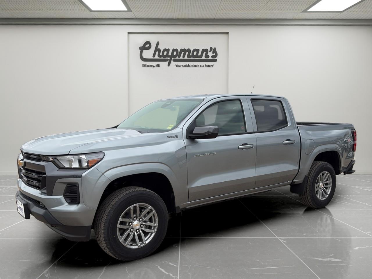 <p>Finished in Sterling Grey Metallic with a Jet Black interior, this 2026 Chevrolet Colorado LT Crew Cab 4WD delivers midsize truck versatility with modern technology and confident capability. With its spacious Crew Cab layout, refined interior, and practical utility features, its built for everyday driving, weekend adventures, and light-duty towing.</p><p>Powered by the 2.7L TurboMax engine paired with an 8-speed automatic transmission, this Colorado delivers strong torque and responsive performance. Equipped with 4WD, an advanced trailering package, and an automatic locking rear differential, its ready for towing, rough roads, and changing Canadian conditions.</p><h3>Performance & Capability</h3><ul><li><p>2.7L TurboMax engine</p></li><li><p>8-speed automatic transmission</p></li><li><p>4WD with Autotrac electronic transfer case</p></li><li><p>Automatic locking rear differential</p></li><li><p>Advanced Trailering Package</p></li><li><p>Integrated trailer brake controller</p></li><li><p>Trailering app with hitch guidance capability</p></li><li><p>Trailer sway control and hill start assist</p></li><li><p>220-amp alternator</p></li><li><p>Engine block heater</p></li></ul><h3>Interior Comfort & Convenience</h3><ul><li><p>8-way power driver seat with lumbar control</p></li><li><p>Dual-zone automatic climate control</p></li><li><p>Sliding rear window</p></li><li><p>Remote vehicle start</p></li><li><p>Keyless open and push-button start</p></li><li><p>Front bucket seats with centre console</p></li><li><p>Rear 60/40 split-folding bench seat with storage</p></li><li><p>Wrapped steering wheel</p></li><li><p>Rear seat reminder</p></li><li><p>Carpeted floor mats</p></li></ul><h3>Technology & Connectivity</h3><ul><li><p>11.3" advanced colour touchscreen display</p></li><li><p>Google built-in capability with navigation support</p></li><li><p>Wireless Apple CarPlay & Android Auto</p></li><li><p>11" digital driver information centre</p></li><li><p>SiriusXM with trial subscription</p></li><li><p>OnStar Basics connected services</p></li><li><p>USB ports throughout cabin</p></li></ul><h3>Safety & Driver Assistance</h3><ul><li><p>Automatic emergency braking</p></li><li><p>Forward collision alert</p></li><li><p>Front pedestrian and bicyclist braking</p></li><li><p>Lane keep assist with lane departure warning</p></li><li><p>Following distance indicator</p></li><li><p>IntelliBeam automatic high beams</p></li><li><p>Rear cross traffic braking</p></li><li><p>Rear park assist</p></li><li><p>HD rear vision camera</p></li><li><p>Teen Driver technology</p></li><li><p>Buckle to Drive system</p></li></ul><h3>Exterior Highlights</h3><ul><li><p>Sterling Grey Metallic exterior</p></li><li><p>17" Argent Metallic aluminum wheels</p></li><li><p>StowFlex tailgate</p></li><li><p>Remote locking tailgate</p></li><li><p>CornerStep rear bumper</p></li><li><p>Deep tinted rear glass</p></li><li><p>Power heated mirrors</p></li><li><p>Automatic headlamp and taillamp control</p></li><li><p>Front recovery hooks</p></li><li><p>All-season tires</p></li></ul><p>A capable midsize truck that combines TurboMax performance, advanced trailering technology, and modern comfort for both work and everyday driving.</p><p>2 Year/24,000 kilometer* Complimentary Oil Changes (2 total)</p><p>3 Year/60,000 kilometer* Base Warranty Coverage</p><p>5 Year/100,000 kilometer* Powertrain Component Warranty Coverage</p><p>5 Year/100,000 kilometer* Courtesy Transportation and 24/7 Roadside Assistance</p><p>6 Year/160,000 kilometer* Sheet Metal (Rust Through) Perforation Warranty Coverage</p><p>*Whichever Comes First.</p><p>Price Includes Dealer Fee.</p><p>Price Excludes PST & GST.</p><p>Financing Options Available, Call For More Details.</p> <p><strong>*While every reasonable effort is made to ensure the accuracy of this information, we are not responsible for any error or omissions contained on these pages. Please verify any information in question with Chapman Motors Ltd.</strong></p>