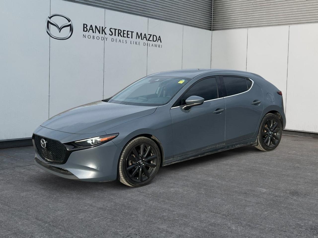 The 2019 Mazda Mazda3 Sport GT in a captivating shade is ready to elevate your driving experience with its impressive AWD handling. This suave sedan combines dynamic performance with exquisite style, making it the perfect companion for Canadian roads. Admire its refined exterior featuring elegant lines and sleek alloy wheels that exude sophistication. Step inside to find an inviting interior adorned with luxurious leather seats and a leather/metal-look gear shifter that radiate comfort and elegance. The sunroof/moonroof enhances your drive with a touch of open-air luxury. Embrace cutting-edge technology at your fingertips with smart device integration, a navigation system, and a heads-up display. Safety is paramount, thanks to advanced features such as lane assist, brake assist, adaptive cruise control, and parking sensors, offering peace of mind on every journey. Whether for urban commutes or scenic road trips, the Mazda3 Sport GT is tailored for drivers who value performance and sophistication. Contact our dealership today to learn more and schedule a test drive. Experience firsthand why this vehicle is the ideal choice for those who demand more from their ride.