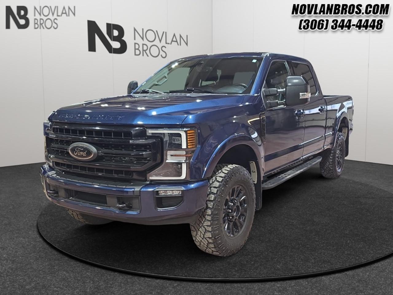 <b>Tremor, Navigation, Heated Seats, Alloy Wheels, Reverse Sense System!</b><br> <br> Check out our great inventory of pre-owned vehicles at Novlan Brothers!<br> <br>Brutish power and payload capacity are key traits of this Ford F-250, while aluminum construction brings it into the 21st century. This 2020 Ford F-250 Super Duty is for sale today in Paradise Hill.<br> <br>The most capable truck for work or play, this heavy-duty Ford F-250 never stops moving forward and gives you the power you need, the features you want, and the style you crave! With high-strength, military-grade aluminum construction, this F-250 Super Duty cuts the weight without sacrificing toughness. The interior design is first class, with simple to read text, easy to push buttons and plenty of outward visibility. This truck is strong, extremely comfortable and ready for anything.<br> <br>This Crew Cab 4X4 pickup has 131,012 km. Its Blue in colour. It has a 10 Speed Automatic transmission and is powered by a 430HP 7.3L 8 Cylinder Engine. <br> <br> Our F-250 Super Dutys trim level is Lariat. Stepping up to this premium F-250 Lariat is an excellent decision as it comes loaded with unique aluminum wheels, heated and cooled leather seats, a premium Bang & Olufsen 10 speaker audio system with SiriusXM radio, chrome exterior accents with a built-in rear bumper step, a Class V trailer hitch and power extendable trailer style mirrors. It also includes a colour touchscreen, side running boards, 10-way power front seats, FordPass Connect 4G LTE with a smart device remote start, a power locking tailgate with remote keyless entry and driver keypad, Ford Co-Pilot360 with rear parking sensors, blind spot detection, a leather steering wheel, lane departure warning, automatic emergency braking, dual zone climate control, power adjustable pedals and so much more. This vehicle has been upgraded with the following features: Tremor, Navigation, Heated Seats, Alloy Wheels, Reverse Sense System, Rear View Camera, Remote Engine Start.<br> To view the original window sticker for this vehicle view this <a href=http://www.windowsticker.forddirect.com/windowsticker.pdf?vin=1FT7W2BN3LEE54462 target=_blank>http://www.windowsticker.forddirect.com/windowsticker.pdf?vin=1FT7W2BN3LEE54462</a>. <br/><br> <br>To apply right now for financing use this link: <a href=http://novlanbros.com/credit/ target=_blank>http://novlanbros.com/credit/</a><br> <br/>Payments from <b>$849.24</b> monthly with $0 down for 84 months @ 8.99% APR O.A.C. ( Plus applicable taxes - Plus applicable fees ). See dealer for details. <br><br>The Novlan family is owned and operated by a third generation and committed to the values inherent from our humble beginnings.<br> Come by and check out our fleet of 20+ used cars and trucks and 90+ new cars and trucks for sale in Paradise Hill.  o~o