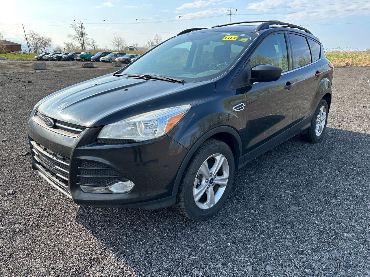 Sold As-Is. CarFax Provided. Minor exhaust leak. Low mileage! This clean and nicely-equipped Escape provides a comfortable and engaging ride. Power 2.0 EcoBoost engine paired with all wheel drive. Microsoft Sync infotainment system. Dont miss your chance at this sharp black SUV, book your appointment to view ASAP!