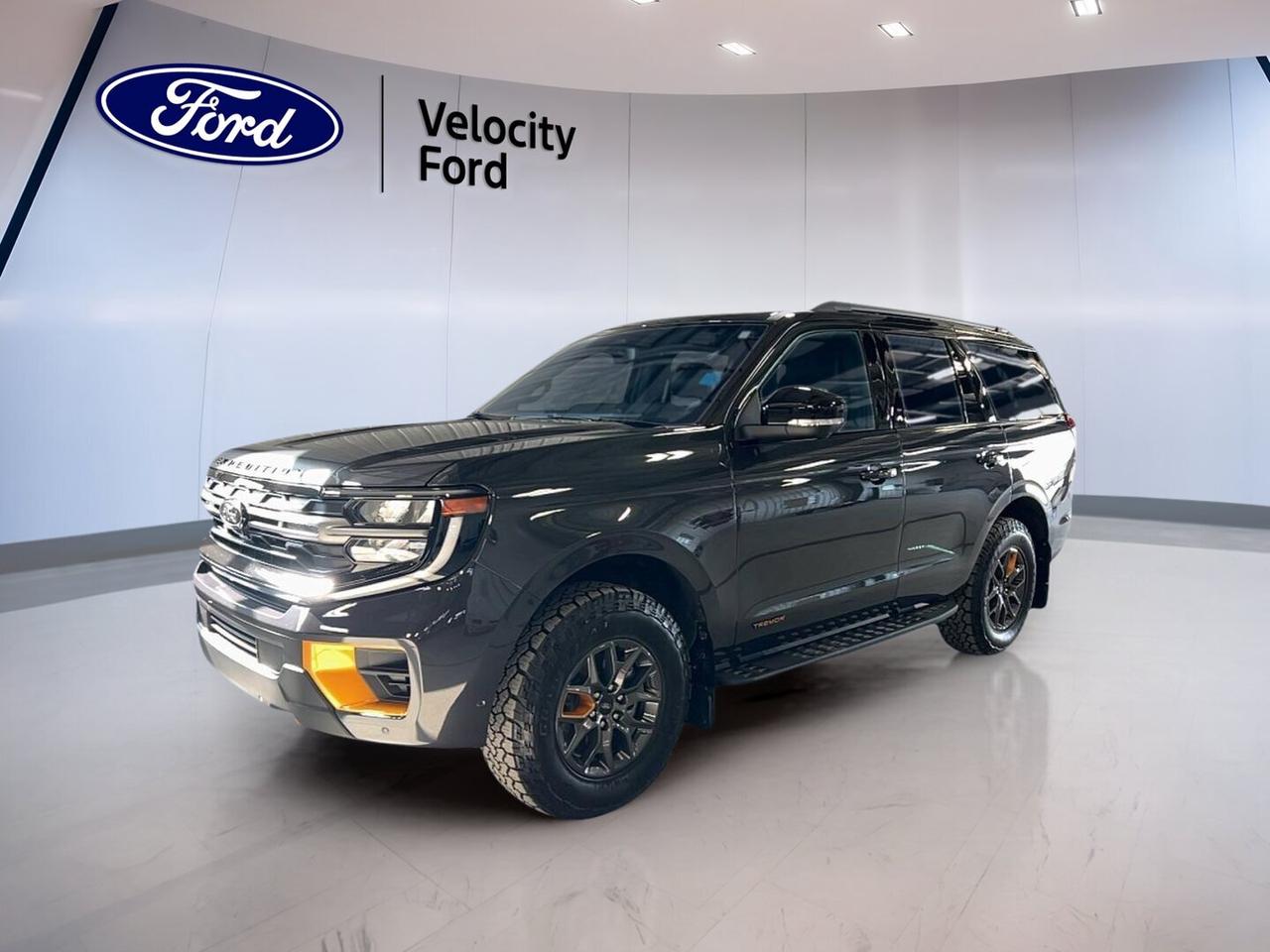 // ACCIDENT FREE!! //

This 2025 Ford Expedition Tremor 4x4 delivers full-size SUV strength with real off-road attitude and family-ready comfort. Offered by Velocity Ford in Moose Jaw, this used Ford has just 7,469 km, a Grey exterior, Black interior, four doors, and a 3.5-litre unleaded engine with automatic transmission.

CARFAX Canada reports no accident, giving you added peace of mind as you shop. The Ford Expedition Tremor 4x4 blends strong capability, advanced driver aids, and premium convenience features, making it a smart choice for drivers who want space, confidence, and modern technology in one well-equipped SUV.

FEATURES OF THE Expedition Tremor 4x4
»» Off-road tires for added trail grip
»» Four-wheel drive for all-surface traction
»» Rear tow hook supports rugged recovery
»» Steps help with easy daily entry

ADVANCED SAFETY FEATURES
»» Backup camera helps with safer reversing
»» Blind spot monitor adds lane-change awareness
»» Lane departure warning supports highway confidence
»» Side and head airbags enhance protection

PERFORMANCE AND EFFICIENCY
»» 3.5-litre unleaded engine delivers strong output
»» Automatic transmission provides smooth gear changes
»» Limited slip differential improves traction control
»» Four-wheel drive boosts rough-road capability

COMFORT AND CONVENIENCE
»» Heated front seats add cold-weather comfort
»» Heated rear seats keep passengers cozy
»» Dual-zone climate control improves cabin comfort
»» Remote starter adds everyday convenience

TECHNONOLGY AND CONNECTIVITY
»» Navigation system helps guide every trip
»» Bluetooth integration supports hands-free communication
»» WiFi hotspot keeps devices connected
»» Steering wheel audio controls simplify access

CARGO SPACE
»» Power liftgate makes loading easier
»» Large cabin suits family travel needs
»» Four-door layout improves passenger access
»» Spare tire adds travel reassurance

The Ford Expedition Tremor 4x4 also adds upscale details that make every drive more enjoyable. You get a panoramic sunroof, glass sunroof, ambient lighting package, memory seats, memory mirrors, adjustable pedals, heated mirrors, retractable mirrors, tinted windows, rear spoiler, and rear climate control for a refined and flexible driving experience.

This Ford is also equipped with power steering, power windows, front air conditioning, automatic climate control, push button start, automatic headlights, fog lights, LED headlamps, HD Radio, satellite radio, auto-dimming rearview mirror, driver lumbar support, passenger lumbar support, driver power seat, power passenger seat, and remote trunk release.

WHAT OTHER OWNERS LIKE
»» Strong towing-ready power for daily driving
»» Spacious cabin for family road trips
»» User-friendly technology and helpful connectivity
»» Confident ride in changing road conditions

This 2025 Ford Expedition Tremor 4x4s VIN is: 1FMJU1RGXSEA46855.