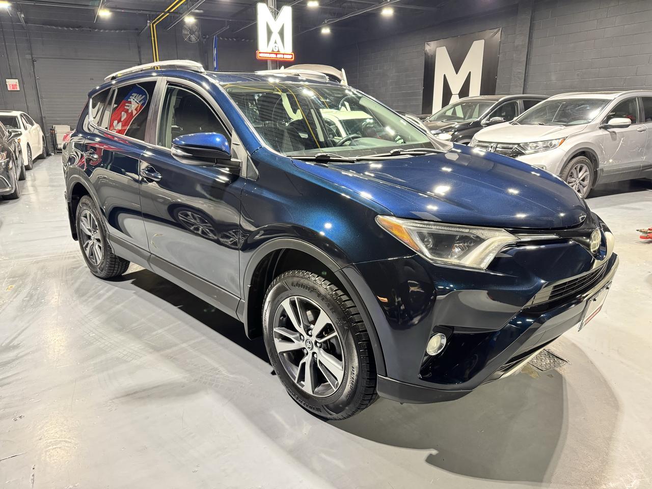 2017 Toyota RAV4 AWD 4dr XLE Photo2