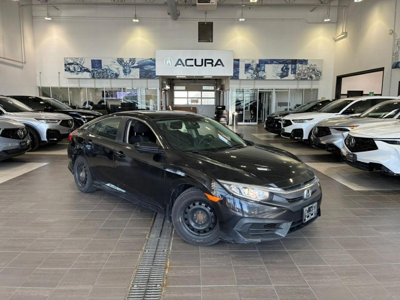 Bluetooth, Lane Departure, Market Value Pricing, Not a Rental, Local Trade, ** All vehicles are all in priced, No additional fees are applied., Black Cloth, 4-Wheel Disc Brakes, Air Conditioning, AM/FM radio, Apple CarPlay/Android Auto, Driver door bin, Electronic Stability Control, Exterior Parking Camera Rear, Front anti-roll bar, Front Bucket Seats, Heated door mirrors, Heated Front Bucket Seats, Outside temperature display, Overhead airbag, Speed control, Speed-sensing steering, Tachometer.

Recent Arrival! 2017 Honda Civic LX
2.0L I4 DOHC 16V i-VTEC CVT FWD


CARFAX Canada One Owner

** All vehicles are all in priced, No additional fees are applied. This vehicle is being sold as is, unfit, not e-tested and is not represented as being in roadworthy condition, mechanically sound or maintained at any guaranteed level of quality. The vehicle may not be fit for use as a means of transportation and may require substantial repairs at the purchasers expense. It may not be possible to register the vehicle to be driven in its current condition.

Awards:
  * 2017 IIHS Top Safety Pick (When equipped with Honda Sensing)   * 2017 KBB.com 10 Most Awarded Brands   * 2017 KBB.com Brand Image Awards
Kelley Blue Book Brand Image Awards are based on the Brand Watch(tm) study from Kelley Blue Book Market Intelligence. Award calculated among non-luxury shoppers.  For more information, visit www.kbb.com. Kelley Blue Book is a registered trademark of Kelley Blue Book Co., Inc.