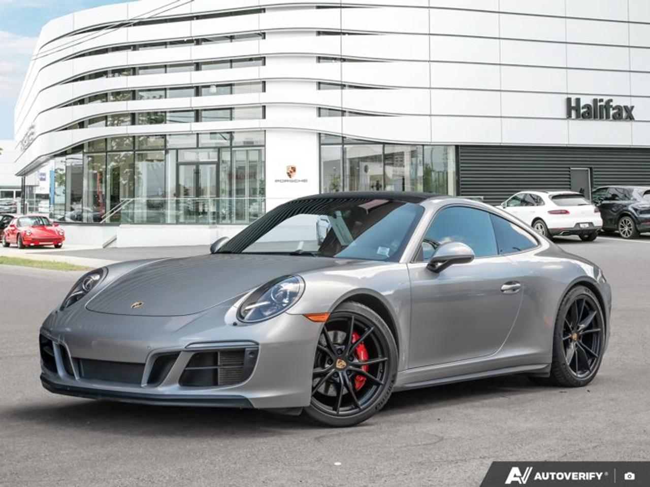 This 2018 Porsche 911 Carrera GTS, now available at Porsche Of Halifax, is finished in GT Silver Metallic with a Leather Interior in Black/Dark Silver with Sport-Tex seat centers and is equipped with a PDK transmission.2- Year, unlimited odometer Porsche Approved Warranty starting upon purchase date. Need more time for the warranty? We have options available.Powertrain and Drivetrain3.0-litre twin-turbocharged flat-6 engine producing 450 horsepowerPDK transmissionRear-wheel driveExteriorGT Silver MetallicElectric slide/tilt sunroof in glass20 Carrera S wheelsInterior and SeatingLeather Interior in Black/Dark Silver with Sport-Tex seat centersSport Seats PlusGT Sport steering wheelSeat heatingSeat belts in Silver GreyInterior trim painted in exterior colorTechnology and Driver AssistancePower Steering PlusLane Change Assist (LCA)Automatically dimming mirrorsBOSE® Surround Sound SystemSmoking PackageLuggage net in passenger footwellThis 911 Carrera GTS is configured with a performance-focused rear-wheel-drive layout, an engaging twin-turbocharged powertrain, and a balance of comfort, driver assistance, and GTS-specific design features.Visit www.porscheofhalifax.com or call (902)453-8800 to speak with a Porsche Sales Executive.