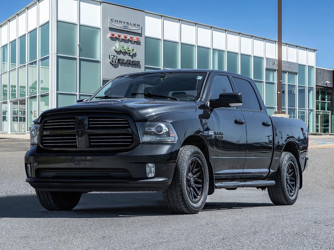 2016 RAM 1500 4WD Crew Cab 140.5  Sport Photo0
