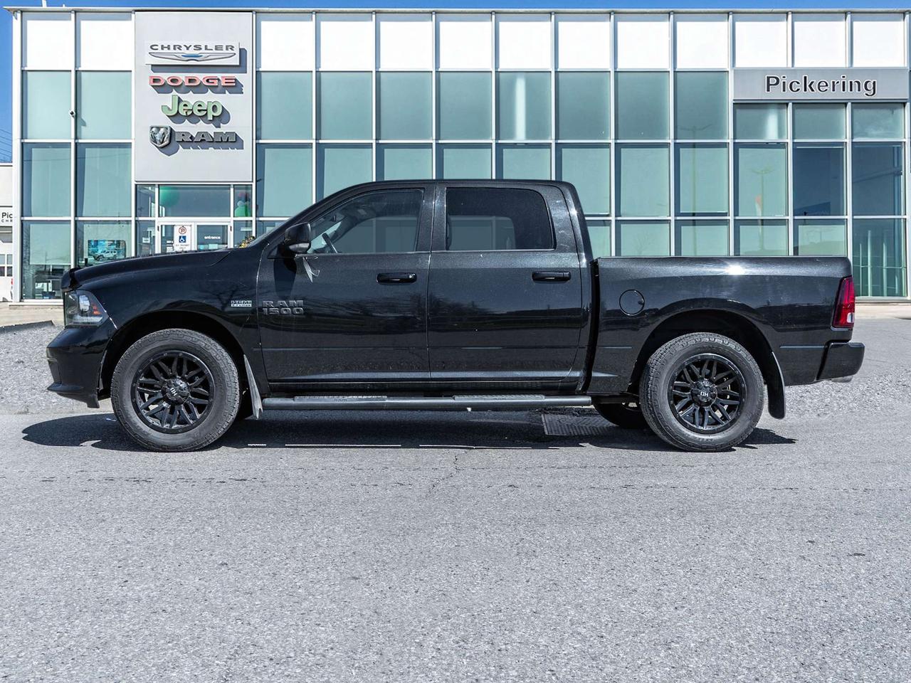 2016 RAM 1500 4WD Crew Cab 140.5  Sport Photo2