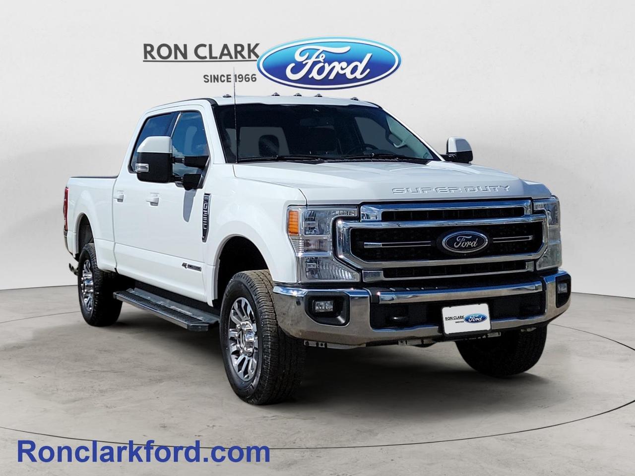 This preowned 2021 Ford F-350 Lariat Crew Cab is built to deliver serious capability, refined comfort, and confidence on every job or journey. Finished in Oxford White with a premium Black leather interior, this heavy-duty truck combines rugged durability with upscale refinement.Powered by the legendary 6.7L Power Stroke V8 Turbo Diesel engine paired with a smooth 10-speed automatic transmission, this F-350 is engineered for exceptional towing power and long-lasting performance. Equipped with the 618A Equipment Group, it comes loaded with advanced features designed to enhance convenience, safety, and productivity.Confidence comes standard with Adaptive Cruise Control, Pro Trailer Backup Assist with UTT Camera System, a Rearview Camera, Trailer Brake Controller, and a full Trailer Tow Package complete with Trailer Tow Mirrors and Heavy-Duty Shocks. Whether you’re hauling on the job site or towing recreational equipment, this truck is ready for the challenge.Exterior highlights include roof clearance lights, a Tough Bed spray-in bedliner, running boards for easy access, a rear sliding window, and remote start for added convenience.Inside, the cabin is designed for comfort and control with power front heated seats, a B&O premium sound system, SYNC 3 infotainment, and a universal garage door opener. Every detail is crafted to make long drives more enjoyable.Bold, capable, and well-equipped, this F-350 Lariat delivers the perfect balance of power, technology, and comfort—ready to take on whatever you throw at it.All Pre-Owned vehicles come standard with one key. If we received additional keys from the previous owner they will be with the vehicle upon delivery at no cost. Additional keys may be purchased at customers request and expense.Come to the dealer you can trust. 60 years and counting Ron Clark Ford & Jayco RV is known for great value and being best in customer service! We serve and deliver all over Ontario including destinations such as Wyoming, Petrolia, Sarnia, London, Guelph, Kitchener-Waterloo, Hamilton, GTA, Ottawa & Chatham-Kent. Call or visit us at RON CLARK FORD & JAYCO RV to view and test drive today! RON CLARK FORD where else!!