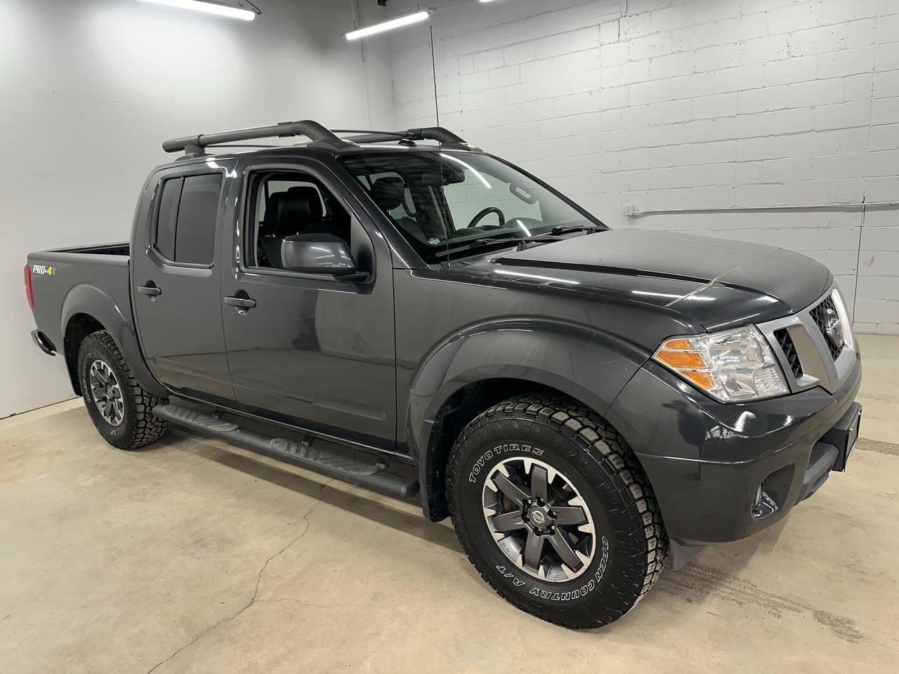 <p>Looking for a rugged and reliable pickup thats ready for anything? Then check out this used 2015 Nissan Frontier Pro-4X, currently available at Troys Toys! This tough truck, boasting a classic grey exterior and a comfortable gray interior, is built to handle both your daily commute and off-road adventures. With its robust 4-wheel drive system and automatic transmission, youll be prepared to conquer any terrain that comes your way. This Frontier has a well-maintained 145,083km on the odometer, ready for many more adventures to come.</p><p>The Pro-4X trim is all about performance and capability. This Frontier is a true workhorse. This truck is equipped to handle your toughest tasks and your wildest weekend getaways. Ready to hit the trails?</p><p>Here are five features of this 2015 Nissan Frontier Pro-4X that will get you excited:</p><ul><li><strong>Conquer any terrain:</strong> The 4-wheel drive system gives you the confidence to tackle challenging off-road conditions.</li><li><strong>Ready for Action:</strong> Built with a sturdy pickup truck body style.</li><li><strong>Convenient and easy:</strong> The automatic transmission makes driving a breeze, whether youre in the city or on the trail.</li><li><strong>Comfort and Style:</strong> The gray interior offers a comfortable and inviting space.</li><li><strong>Built to last:</strong> This truck is ready for your next adventure.</li></ul><p><strong><em>Powered by AutoIntelligence&trade;</em></strong> Vehicle information has been generated using artificial intelligence and is provided for informational purposes only. While efforts are made to ensure accuracy, please confirm all details directly with the dealer.</p>