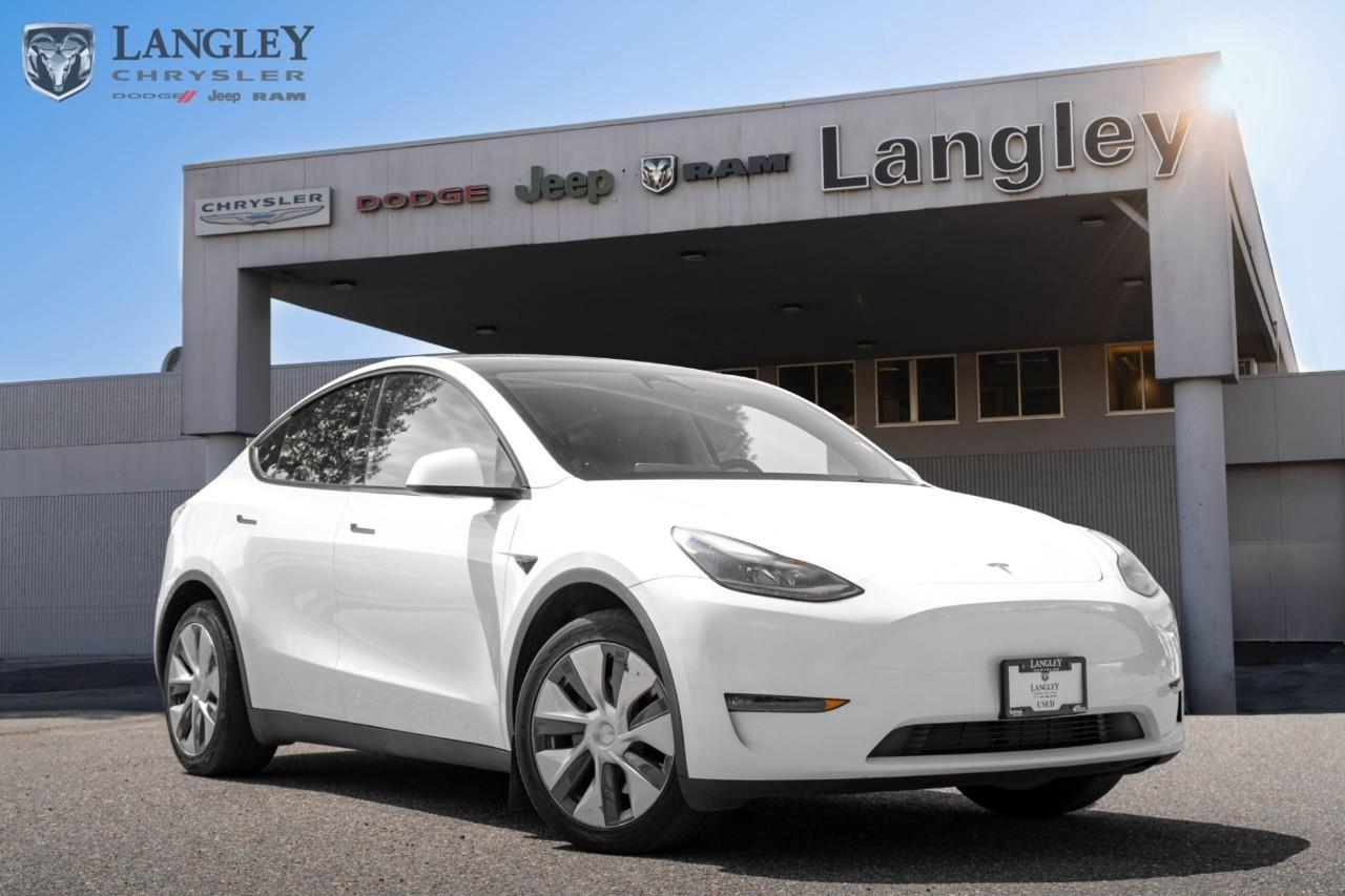 <p><strong>2023 TESLA MODEL Y LONG RANGE AWD</strong></p><p>The 2023 Tesla Model Y Long Range AWD is a versatile electric crossover that balances expansive storage with high-performance dual-motor capability and class-leading range.</p><ul><li><p>Combined Power: 384 hp</p></li><li><p>Total Torque: 376 lb-ft</p></li><li><p>All-Electric Range: Up to 531 km</p></li><li><p>0-100 km/h: 5.0 seconds</p></li><li><p>Battery Capacity: 81 kWh Lithium-ion</p></li></ul><p>Come book a test drive at Langley Chrysler, conveniently located in Langley, British Columbia.</p>

<p>*All prices plus applicable taxes, applicable environmental recovery charges, documentation of $599 and full tank of fuel surcharge of $76 if a full tank is chosen. <br />Other protection items available that are not included in the above price:<br />Tire & Rim Protection and Key fob insurance starting from $599<br />Service contracts (extended warranties) for coverage up to 7 years and 200,000 kms starting from $599<br />Custom vehicle accessory packages, mudflaps and deflectors, tire and rim packages, lift kits, exhaust kits and tonneau covers, canopies and much more that can be added to your payment at time of purchase<br />Undercoating, rust modules, and full protection packages starting from $199<br />Financing Fee of $500 when applicable<br />Flexible life, disability and critical illness insurances to protect portions of or the entire length of vehicle loan</p>