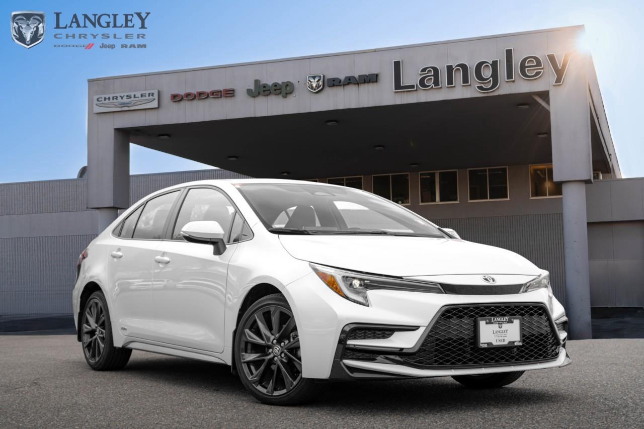 <p><strong>2024 Toyota Corolla Hybrid XSE AWD</strong></p><p>The 2024 Toyota Corolla Hybrid XSE is the top-tier fuel-saver, combining a segment-exclusive electronic AWD system with premium SofTex upholstery and sporty 18-inch wheels.</p><p></p><ul><li><p><strong>Engine</strong>: 1.8L 4-Cylinder with Toyota Hybrid Synergy Drive (138 net hp)</p><p></p></li><li><p><strong>Drivetrain</strong>: Electronic On-Demand All-Wheel Drive (AWD) with E-CVT</p><p></p></li><li><p><strong>Efficiency</strong>: 5.0 L/100 km City / 5.7 L/100 km Highway</p><p></p></li><li><p><strong>Max Towing</strong>: Not recommended for towing</p><p></p></li><li><p><strong>Technology</strong>: 8-inch Toyota Multimedia touchscreen, wireless Apple CarPlay/Android Auto, and 7-inch digital cluster</p><p></p></li><li><p><strong>Key Features</strong>: Power moonroof, 8-way power drivers seat, heated front and rear seats, and Toyota Safety Sense 3.0</p></li></ul><p>Come book a test drive at Langley Chrysler, conveniently located in Langley, British Columbia.</p>

<p>*All prices plus applicable taxes, applicable environmental recovery charges, documentation of $599 and full tank of fuel surcharge of $76 if a full tank is chosen. <br />Other protection items available that are not included in the above price:<br />Tire & Rim Protection and Key fob insurance starting from $599<br />Service contracts (extended warranties) for coverage up to 7 years and 200,000 kms starting from $599<br />Custom vehicle accessory packages, mudflaps and deflectors, tire and rim packages, lift kits, exhaust kits and tonneau covers, canopies and much more that can be added to your payment at time of purchase<br />Undercoating, rust modules, and full protection packages starting from $199<br />Financing Fee of $500 when applicable<br />Flexible life, disability and critical illness insurances to protect portions of or the entire length of vehicle loan</p>