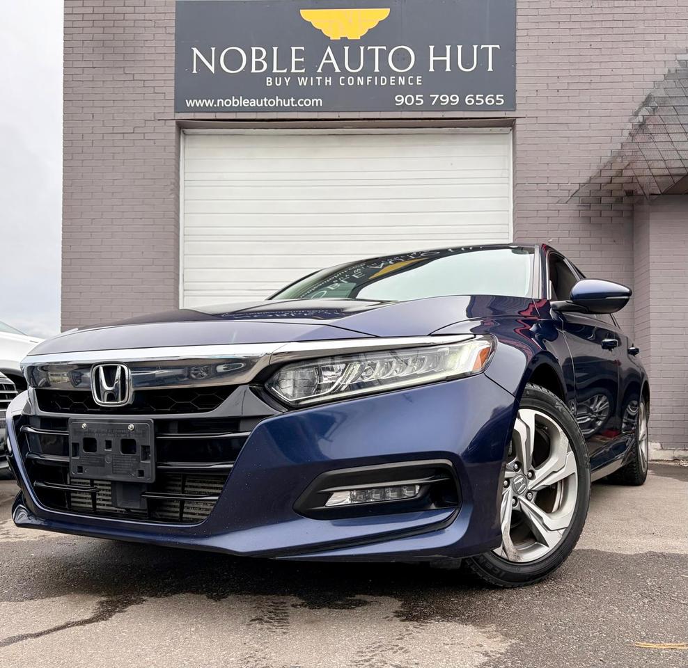 <p style=box-sizing: border-box; padding: 0px; margin: 0px 0px 1.375rem;><strong style=box-sizing: border-box; font-weight: bold;><span style=box-sizing: border-box; font-size: 14pt;>2018 Honda Accord EX,</span></strong> KEYLESS ENTRY, HEATED SEATS, LED HEADLIGHTS, REMOTE STATER, PUSH BUTTON START, APPLE CARPLAY/ ANDROID AUTO, LANE DEPARTURE WARNING, ADAPTIVE CRUISE CONTROL AND MUCH MORE</p><p style=box-sizing: border-box; padding: 0px; margin: 0px 0px 10px; font-family: Open Sans, sans-serif; font-size: 13px; background-color: #ffffff;><span style=box-sizing: border-box; font-size: 14pt;><strong style=box-sizing: border-box; font-weight: bold;>HST and Licensing will be extra**</strong></span></p><p><strong>&bull; On Financed Deals:&nbsp;</strong>We must call this a &ldquo;Finance Fee&rdquo;. It will be a separate line item on the documentation. This fee has already been included in any payment quote advertised by Noble Auto Hut. Our <strong><em>Finance Fee</em></strong>&nbsp;is&nbsp;<strong><em>$999.</em></strong></p><p>&bull; Vehicles sold at Noble Auto Hut are <strong>sold &ldquo;As-Is&rdquo;&nbsp;</strong>and are subject to an optional <strong>Safety Inspection Fee of $799. <em>This vehicle is being sold &ldquo;as-is&rdquo;, unfit, not e-tested and is not represented as being in a road worthy condition, mechanically sound or maintained at any guaranteed level of quality. The vehicle may not be fit for use as a means of transportation and may require substantial repairs at the purchaser&rsquo;s expense. It may not be possible to register the vehicle to be driven in its current condition.</em></strong></p><p><strong>OMVIC FEE&nbsp;</strong></p><p>Ontario Motor Vehicle Industry Council&nbsp;<strong>charges each person in Ontario $22 when they make a vehicle purchase.</strong>&nbsp;</p><p><strong>Licensing Fee&nbsp;</strong></p><p>Noble Auto Hut will facilitate the registration of your new vehicle with Service Ontario. We simply ask to be reimbursed for the cost of registration. This is a common practice when purchasing a vehicle. <strong>$32&nbsp;</strong>to attach your existing license plates to your new vehicle.&nbsp;<strong>$59&nbsp;</strong>to purchase and register new license plates to your new vehicle. Heavy-duty and Commercial Vehicles have varying costs of registration depending on weight and usage.</p><p><strong>Noble Auto Hut Inclusions Explained</strong></p><p><strong>Safety Inspection&nbsp;</strong>Noble Auto Hut will perform an Ontario Safety Standards Inspection on each vehicle at time of sale. Any repairs required to meet Ontario Safety Standards will be done. Noble Auto Hut will provide this service for an <strong><u>optional</u>&nbsp;fee of $799</strong>.&nbsp;</p><p><strong>Keys: </strong>Noble Auto Hut guarantees at least 1 operational key with each vehicle. In the case that a client would like additional keys, they will be made available at our industry wholesale pricing.</p><p><strong>On Cash Deals: </strong>We must call this a &ldquo;Cash Purchase Surcharge&rdquo;. It will be added to the selling price of the vehicle on the documentation.&nbsp;Our&nbsp;<strong><em>Cash Purchase Surcharge</em></strong>&nbsp;is&nbsp;<strong><em>$999.</em></strong></p><p><strong>Vehicle History:</strong> CarFax Vehicle History Reports are readily available when requested. We are happy to provide clients with everything required for them to make an informed decision.</p><p><strong>Fuel & Detail:&nbsp;</strong>Each vehicle will be delivered to its new owner with at least half a tank of fuel and will be fully detailed prior to the client taking delivery.</p><p><strong>15 Hale Rd </strong><strong>Brampton </strong>Come in for a test drive and speak to our sales staff, who will look after all your automotive needs with a friendly, low-pressure approach. Get approved and drive away in your new ride today!</p><p style=box-sizing: border-box; padding: 0px; margin: 0px 0px 10px; font-family: Open Sans, sans-serif; font-size: 13px; background-color: #ffffff;>FINANCING AVAILABLE AT AS LOW AS 6.99% O.A.C</p><p style=box-sizing: border-box; padding: 0px; margin: 0px 0px 10px; font-family: Open Sans, sans-serif; font-size: 13px; background-color: #ffffff;>WE WELCOME EVERYONE-GOOD/BAD CREDIT, NEWCOMERS, STUDENTS. EVERYONE IS APPROVED.</p><p style=box-sizing: border-box; padding: 0px; margin: 0px 0px 10px; font-family: Open Sans, sans-serif; font-size: 13px; background-color: #ffffff;>PREVIOUSLY DECLINED BY BANK ? NO PROBLEM&nbsp;</p><p style=box-sizing: border-box; padding: 0px; margin: 0px 0px 10px; font-family: Open Sans, sans-serif; font-size: 13px; background-color: #ffffff;>LET THE EXPERIENCED PROFESSIONALS HANDLE YOUR CREDIT APPLICATION.&nbsp;</p><p style=box-sizing: border-box; padding: 0px; margin: 0px 0px 10px; font-family: Open Sans, sans-serif; font-size: 13px; background-color: #ffffff;>APPLY FOR PRE-APPROVAL TODAY!!</p><h4 style=box-sizing: border-box; padding: 0px; margin: 10px 0px; line-height: 1.1; font-size: 1.8rem; color: #262425; font-family: Open Sans; background-color: #ffffff;>&nbsp;</h4><h4 style=box-sizing: border-box; padding: 0px; margin: 10px 0px; line-height: 1.1; font-size: 1.8rem; font-family: Open Sans; color: #262425; background-color: #ffffff;>Warranty</h4><p style=box-sizing: border-box; padding: 0px; margin: 0px 0px 10px; font-family: Open Sans, sans-serif; font-size: 13px; background-color: #ffffff; outline: 0px;>36 DAY/1000 KMS WARRANTY ON SAFETY ITEMS.</p><p style=box-sizing: border-box; padding: 0px; margin: 0px 0px 10px; font-family: Open Sans, sans-serif; font-size: 13px; background-color: #ffffff; outline: 0px;>EXTENDED WARRANTY AND GAP INSURANCES ARE AVAILABLE ON REQUEST</p><p style=box-sizing: border-box; padding: 0px; margin: 0px 0px 1.375rem;>&nbsp;</p><p>&nbsp;</p>