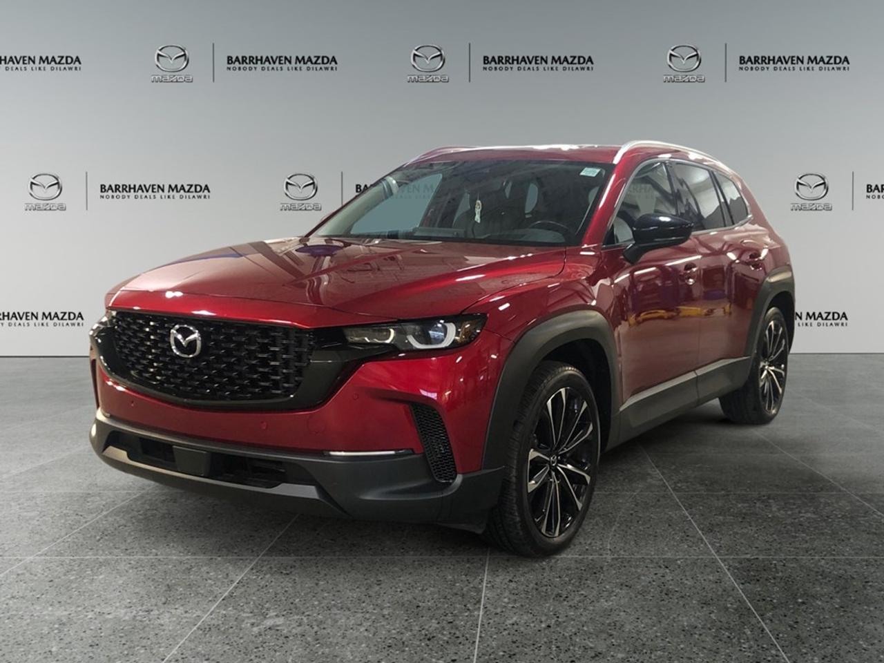 The 2024 Mazda CX-50 GT in a striking red exterior captivates with its AWD performance and confident handling that ensures a smooth and controlled drive, no matter the conditions. This SUV blends practicality with elegance, featuring alloy wheels for a touch of sophistication, and LED lighting that enhances visibility and style. The red hue underscores its dynamic design, making it stand out in every setting. Inside, passenger comfort reigns supreme with luxurious leather seats, heated and cooled options ensuring comfort through all seasons, and a leather-wrapped steering wheel that adds a premium touch. Advanced technology takes center stage in the CX-50 GT, offering a seamless driving experience. The navigation system, paired with smart device integration and a Bluetooth connection, keeps you connected and on the right path, while the heads-up display keeps vital information at your line of sight. Safety is paramount, with driver-assistance features like lane assist, adaptive cruise control, a backup camera, and parking sensors that provide added peace of mind on every journey. Iideal for families and professionals seeking a versatile yet refined vehicle, or anyone with an adventurous spirit looking to make every drive enjoyable, the Mazda CX-50 GT awaits your discovery. Contact our dealership today for more information and to arrange a test drive.