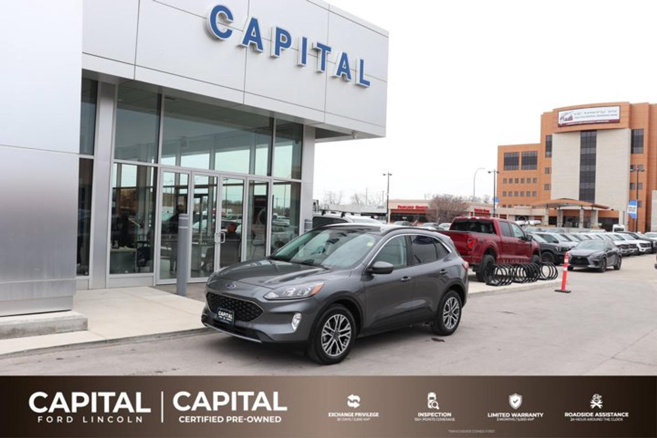 This Gray Ford Escape SE is sleek, smart and more fun than ever! It has the best automatic highway fuel economy in its class. It comes with a AWD Intercooled Turbo Premium Unleaded I-4 2.0 L/122 engine. There are tons of neat features to impress your friends! Bluetooth capability allows you to make hands-free calls, and you can connect your smart phone to play your tunes. It has a SYNC voice activated communications and entertainment system, steering wheel audio controls, USB port, audio input jack and 911 assist. Safety features include dual-stage front airbags, a safety canopy system with side-curtain airbags and rollover sensor. The front bucket seats are heated and will keep you toasty warm in the winter. Contact us today to test drive this Ford Escape SE!Check out this vehicles pictures, features, options and specs, and let us know if you have any questions. Helping find the perfect vehicle FOR YOU is our only priority.P.S...Sometimes texting is easier. Text (or call) 1-204-900-8266 for fast answers at your fingertips!Dealer Permit #4697