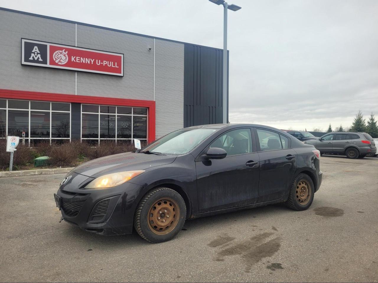2011 Mazda 3 in Black Mica. The vehicle has 156,658km. The vehicle runs and drives ok. Check engine light on. Rust spots found around the vehicle mainly on the rockers. Suspension needs attention. We dont perform any mechanical/safety inspections. The vehicle is sold as is and might need some work.