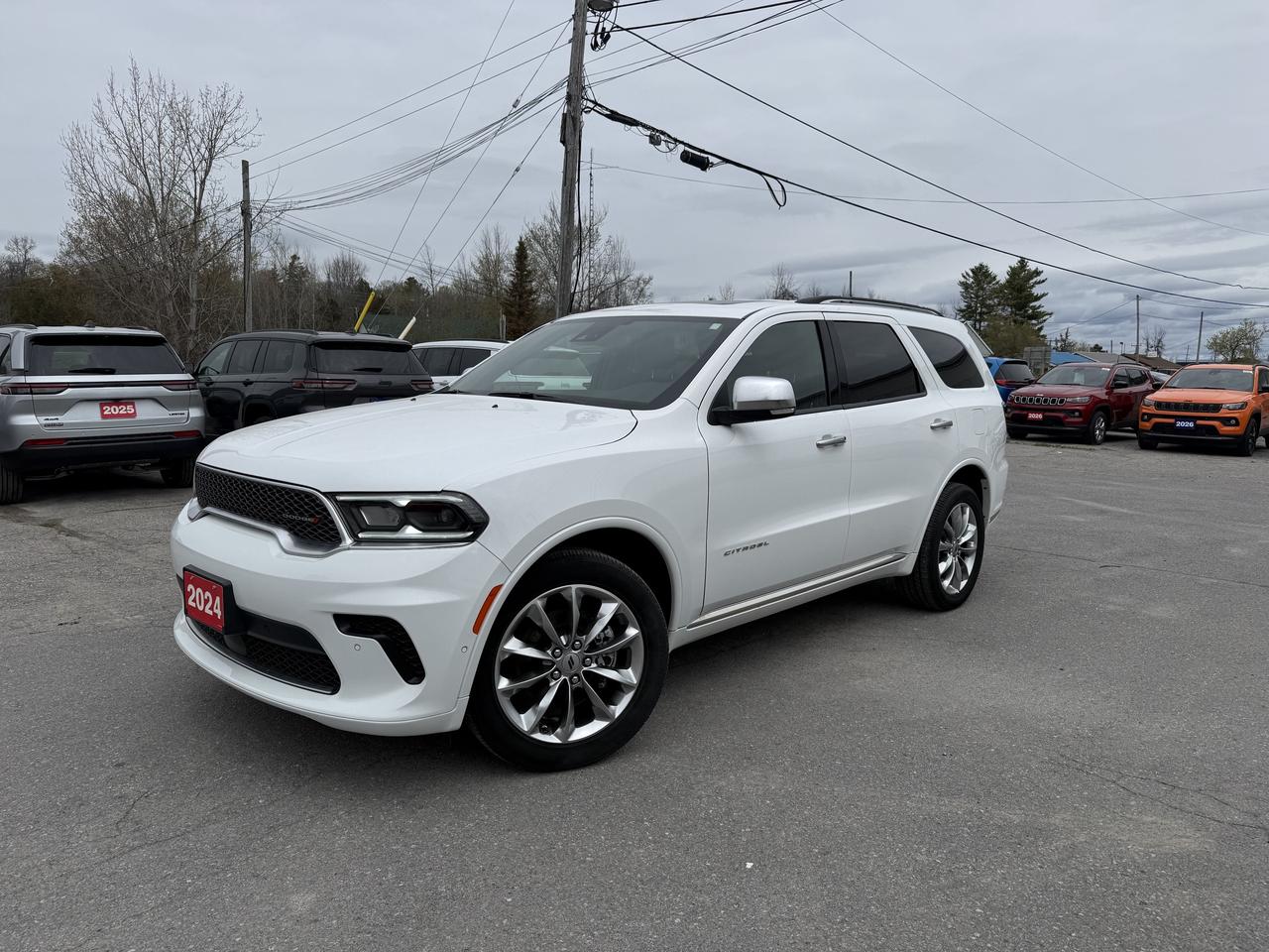 2024 DODGE DURANGO CITADEL AWD.  3.6L PENTASTAR ENGINE WITH 8 SPEED AUTO TRANSMISSION.  POWER SUNROOF, NAPPA LEATHER HEATED & COOLED SEATS, POWER LIFTGATE, 10.1" SCREEN WITH NAVIGATION, WIRELESS CHARGING PAD, 4 & 7 PIN WIRING HARNESS WITH CLASS IV HITCH, REMOTE START, HEATED STEERING WHEEL, ADAPTIVE CRUISE CONTROL, BLIND SPOT MONITOR WITH REAR CROSS DETECTION, LANE KEEP ASSIST, FRONT & REAR PARK ASSIST, FORWARD COLLISION WARNING WITH ACTIVE BRAKING, 2ND ROW HEATED SEATS, 2ND ROW FOLD & TUMBLE CAPTAIN CHAIRS, & MORE!  ONLY HST EXTRA.