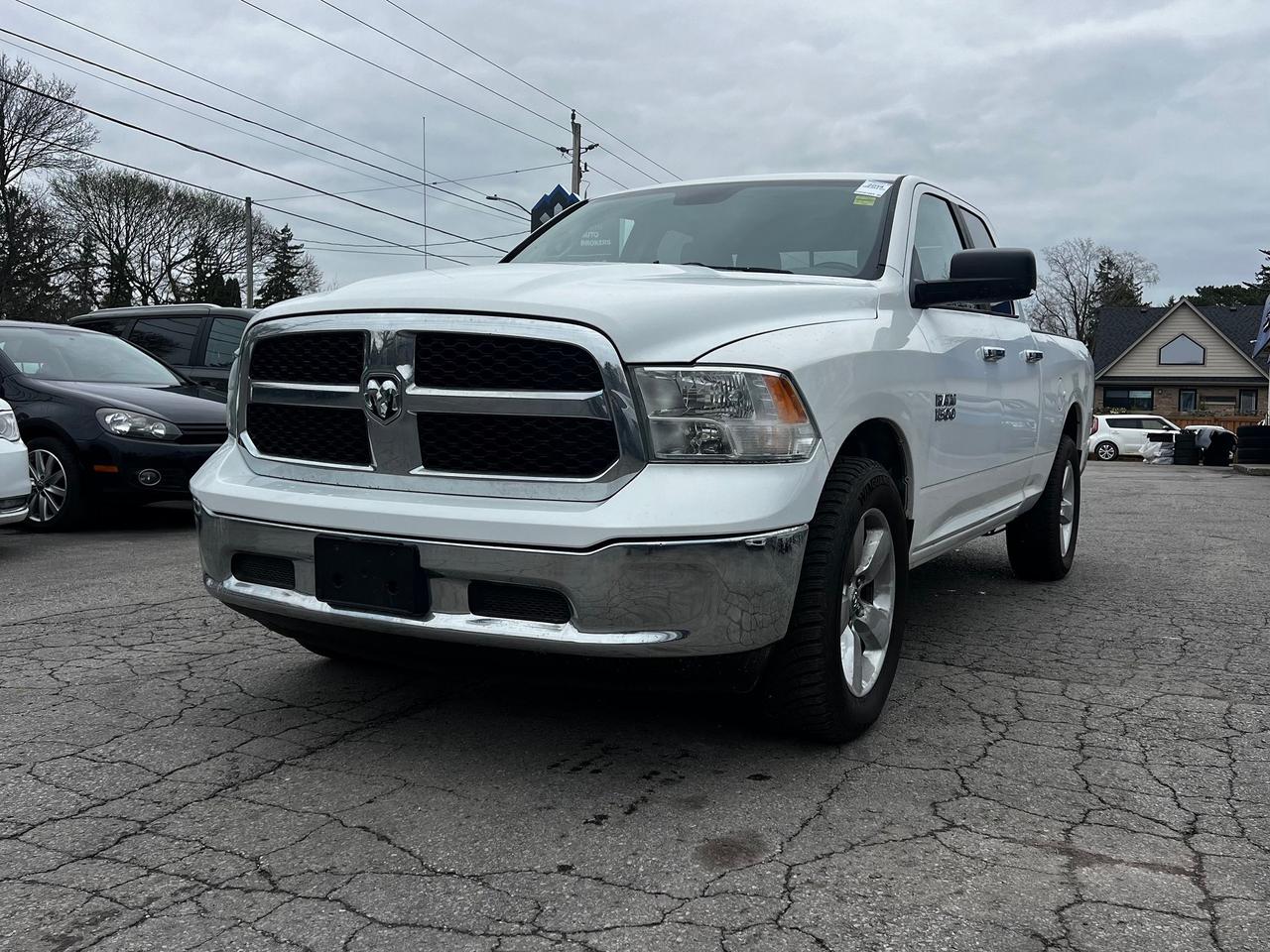 2014 RAM 1500 4WD Quad Cab 140.5" SLT Photo2