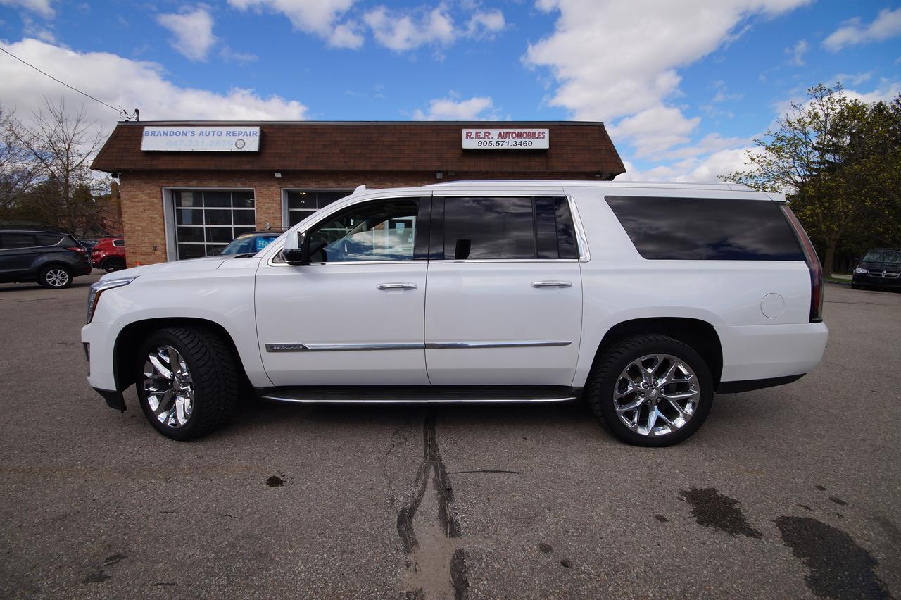 <p>Looking for a luxurious and spacious SUV that commands attention? Feast your eyes on this stunning 2016 Cadillac Escalade ESV Premium Collection, available now at R.E.R. Automobiles Ltd. This beauty offers an unparalleled driving experience, blending opulent comfort with impressive capability. With its elegant white exterior and a welcoming cream interior, this Escalade ESV is sure to turn heads wherever you go. This meticulously maintained SUV has a comfortable 101,265km on the odometer.</p><p>This 4-wheel drive Escalade ESV provides both power and versatility, making it perfect for navigating city streets or embarking on weekend getaways. The automatic transmission ensures a smooth and effortless ride, while the abundance of space allows you to comfortably transport passengers and cargo. Experience the ultimate in automotive luxury with this exceptional vehicle.</p><p>Here are five features of this 2016 Cadillac Escalade ESV Premium Collection that are sure to impress:</p><ul><li><strong>Commanding Presence:</strong> The Escalade ESVs bold design makes a statement wherever it goes.</li><li><strong>Luxurious Interior:</strong> Sink into the plush cream leather seats and enjoy the premium feel.</li><li><strong>4-Wheel Drive Confidence:</strong> Tackle any road condition with ease and confidence.</li><li><strong>Spacious Interior:</strong> Offers ample space for passengers and cargo.</li><li><strong>Premium Collection:</strong> Experience the best in Cadillacs luxury and features.</li></ul><p><strong><em>Powered by AutoIntelligence&trade;</em></strong> Vehicle information has been generated using artificial intelligence and is provided for informational purposes only. While efforts are made to ensure accuracy, please confirm all details directly with the dealer.</p>