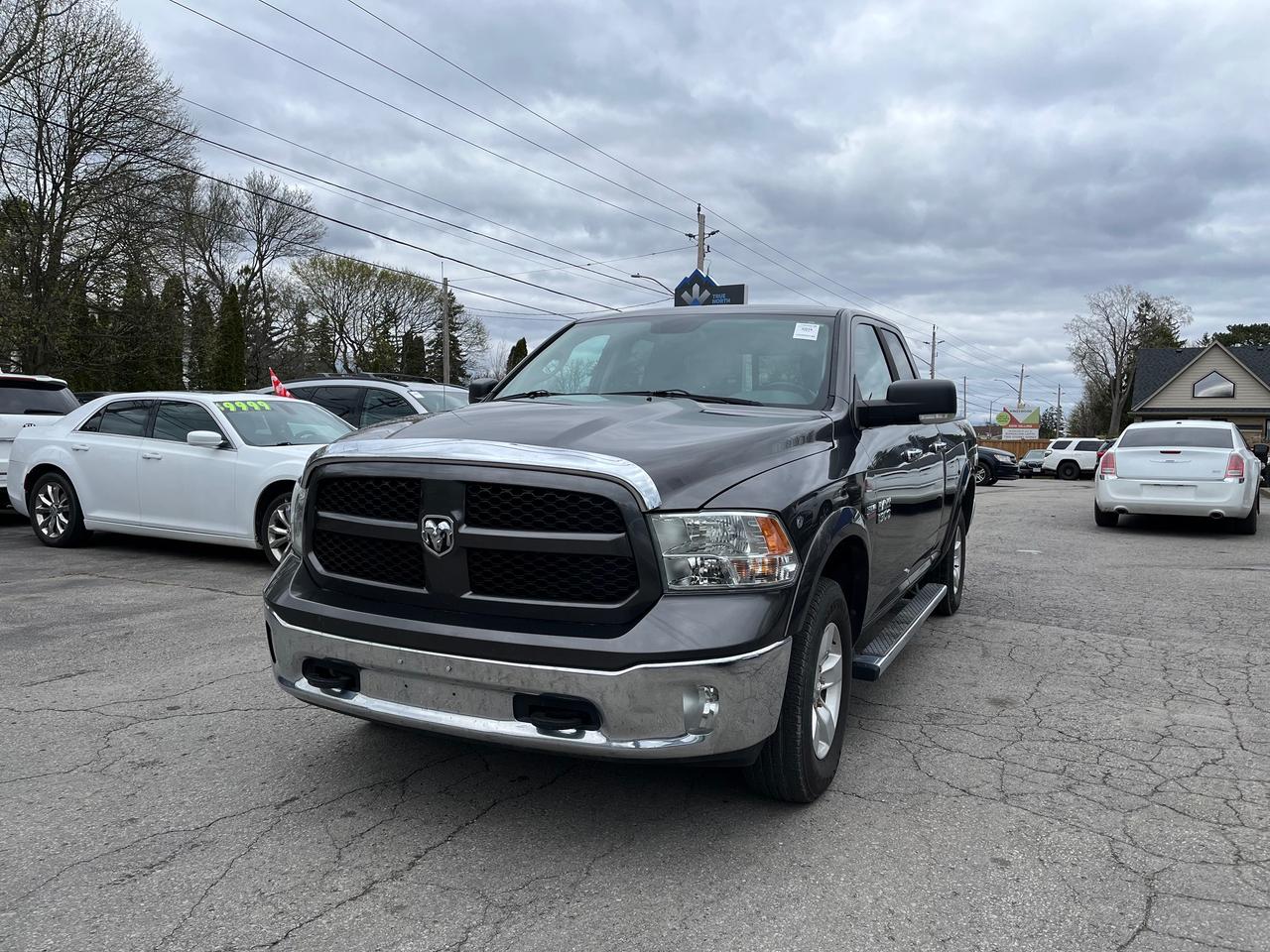 2014 RAM 1500 4WD Quad Cab 140.5" Outdoorsman Photo2
