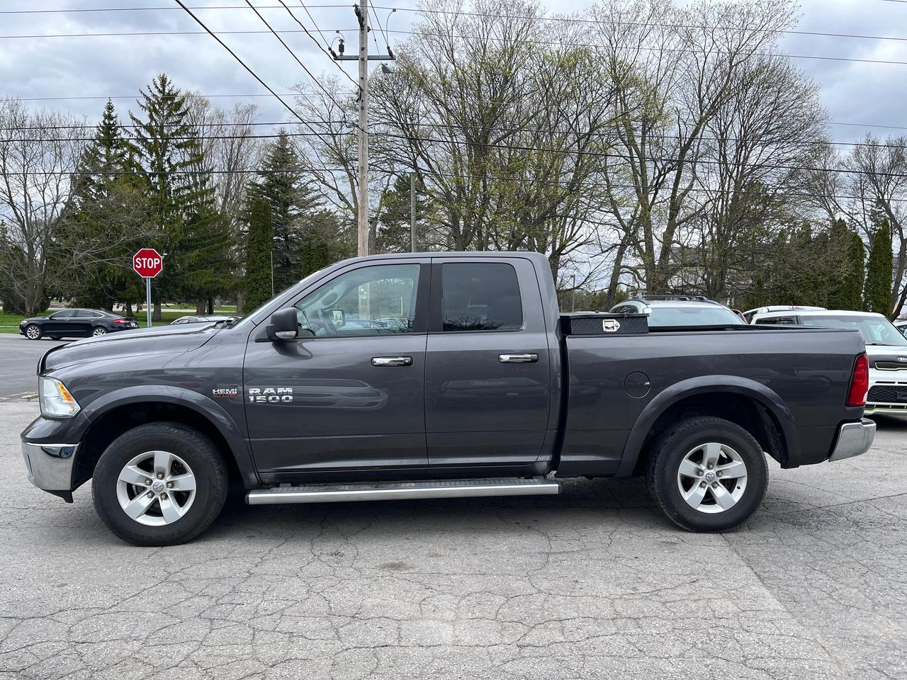 2014 RAM 1500 4WD Quad Cab 140.5" Outdoorsman Photo3