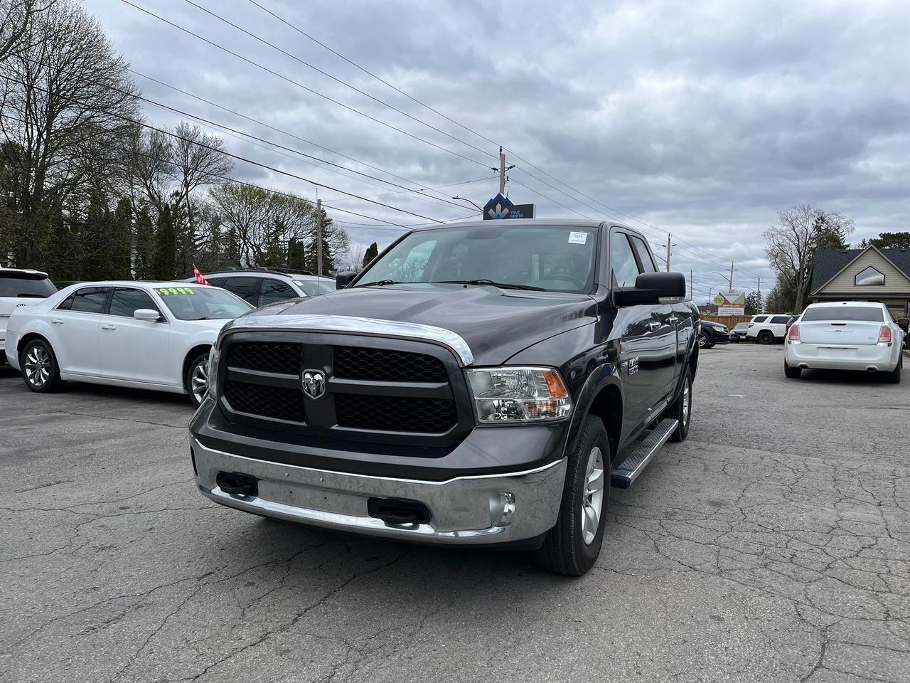 2014 RAM 1500 4WD Quad Cab 140.5" Outdoorsman Photo2