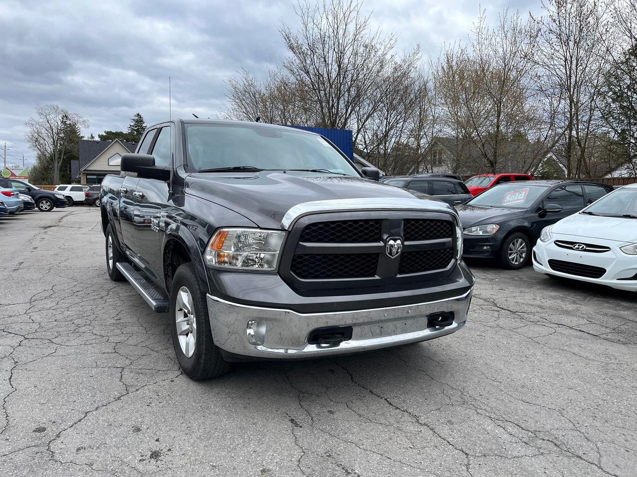 2014 RAM 1500 4WD Quad Cab 140.5" Outdoorsman