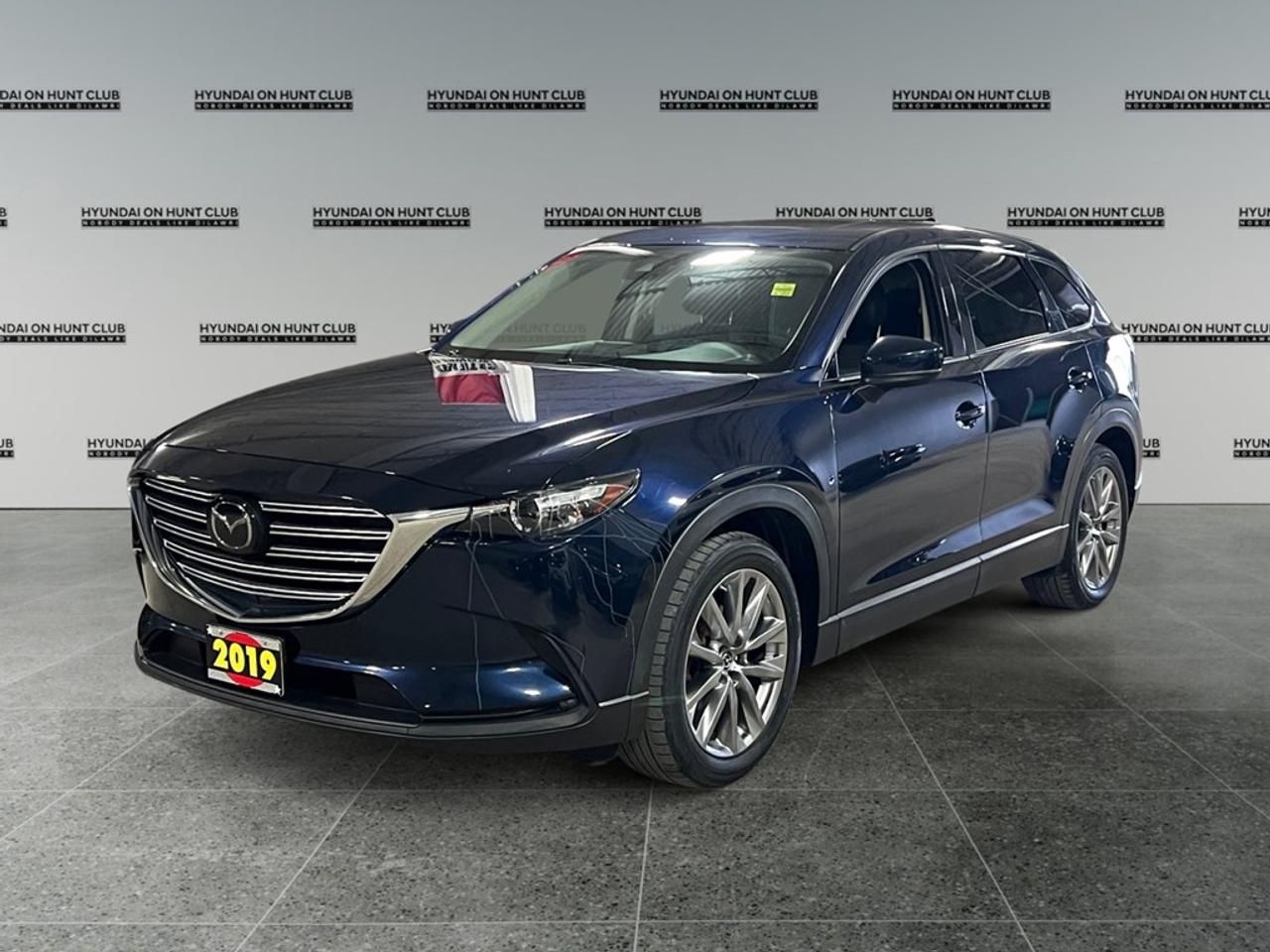 Certified Pre-Owned.The 2019 Mazda CX-9 GS-L, with its striking Black exterior and reliable AWD drivetrain, is a vehicle that masterfully combines performance and style. Its aerodynamic design is enhanced by sleek lines, giving this SUV a dynamic presence on the road. Step inside to experience a refined interior featuring impressive leather seats that provide ultimate comfort for all passengers. The sophisticated atmosphere is further complemented by a leather steering wheel and gear shifter, designed for those who appreciate attention to detail. A panoramic sunroof invites natural light into the cabin, offering an expansive view of the skies above. Incorporating cutting-edge technology, the CX-9 GS-L boasts features such as smart device integration and a formidable backup camera to ensure ease of use and enhanced safety. The advanced driver assistance systems, including adaptive cruise control and lane assist, work in harmony to provide peace of mind on every journey. Heated seats and mirrors add a touch of luxury, making every drive enjoyable, regardless of the weather. This Mazda CX-9 is the perfect SUV for families and adventure enthusiasts who value comfort and innovation in their everyday drive. Contact our dealership today to learn more about how you can make this exceptional vehicle yours. **ADVERTISED PRICE IS FOR FINANCE DEALS ONLY, CASH PRICE MAY BE SUBJECT TO INCREASE. SEE DEALER FOR DETAILS*** $26,499 Cash * $24,388 Finance
