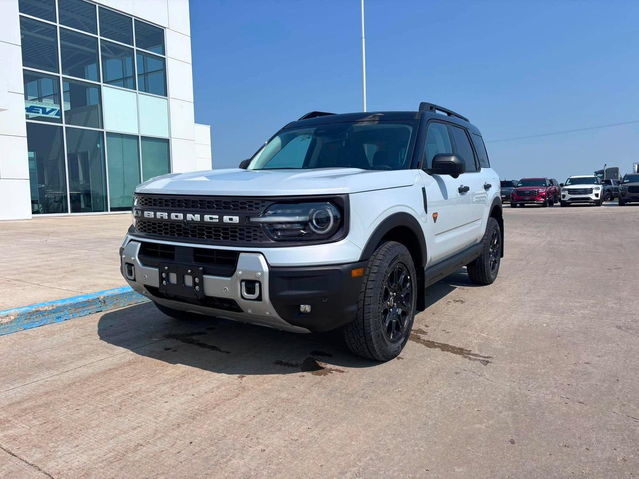 <p>Get ready to explore the untamed with the all-new 2026 Ford Bronco Sport Badlands 4x4, now available at Webbs 1441! This rugged SUV is built for adventure, blending off-road capability with modern comfort and style. Its bold design, highlighted by the sleek SPACE WHITE METALLIC exterior, is sure to turn heads wherever you go. Inside, youll find a thoughtfully designed cabin with premium LEATHER TRIMMED seating and a host of features designed to enhance every journey.</p><p>&nbsp;</p><p>This Bronco Sport Badlands is equipped to handle any terrain. The powerful 2.0L ECOBOOST ENGINE and responsive 8-SPD AUTO TRANSMISSION provide the performance you need, while the 4-Wheel Drive system ensures you can confidently tackle challenging trails. With its spacious interior and versatile cargo area, this SUV is ready for your next weekend getaway or daily commute.</p><p>&nbsp;</p><p>Here are five features that make this Bronco Sport Badlands stand out:</p><p><br><br></p><ul><li><strong>Power Moonroof:</strong> Open up to the sky and enjoy the sunshine and fresh air.</li></ul><p>&nbsp;</p><ul><li><strong>Badlands Tech Package:</strong> Stay connected and informed with the latest technology.</li></ul><p>&nbsp;</p><ul><li><strong>Engine Block Heater:</strong> Ensures easy starts, even on the coldest Canadian mornings.</li></ul><p>&nbsp;</p><ul><li><strong>SecuriCode Keyless Entry Pad:</strong> Provides convenient and secure access to your vehicle.</li></ul><p>&nbsp;</p><ul><li><strong>Floor Liners:</strong> Protect your interior from the elements.</li></ul><p><br><br></p><p><strong><em>Powered by AutoIntelligence&trade;</em></strong><br>Powered by AutoIntelligence&trade;</p><p>&nbsp;</p>