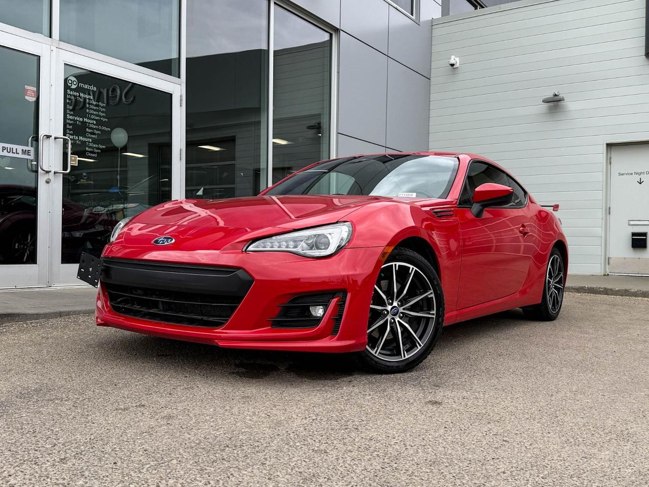 Experience sporty style and performance with this pre-owned 2018 Subaru BRZ Sport-tech Auto in striking Red with a sleek Black interior. Powered by a responsive 2.0L boxer engine paired with a smooth 6-speed automatic transmission, this rear-wheel-drive coupe offers spirited handling with an independent suspension and limited-slip differential. Enjoy comfort and luxury with heated leather and Alcantara sport seats, dual-zone automatic climate control, and advanced tech features including a 7 touchscreen infotainment system with integrated navigation, Bluetooth, and USB ports. Safety is top-notch with six airbags, stability control, hill start assist, and a rearview camera. With its aggressive styling, including a rear wing spoiler and LED headlights, this BRZ is ready to deliver an exhilarating driving experience every day. Dont miss outtest drive this iconic sports coupe today!Go Mazda is an AMVIC licensed businessThis vehicle has been registered in the province ofManitoba and is showing a CarFax incident in the amount of $3,293.66