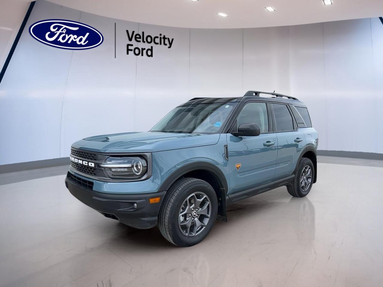 CARFAX Canada reports no accident.

Finished in Blue with a Brown interior, this used 2022 Ford Bronco Sport Badlands 4x4 at Velocity Ford in Moose Jaw brings real SUV capability with everyday comfort. It has 59,347 km, four doors, an automatic transmission, and a 2.0-litre unleaded engine. This Bronco Sport Badlands 4x4 is well equipped for drivers who want confidence on rough roads and calm manners in town.

FEATURES OF THE Bronco Sport Badlands 4x4
»» 2.0-litre turbocharged four-cylinder engine power
»» Standard four-wheel drive for added traction
»» Off-road tires for tougher terrain
»» Rear tow hook for recovery help

ADVANCED SAFETY FEATURES
»» Backup camera helps with reverse parking
»» Blind spot monitor adds lane awareness
»» Lane departure warning supports safer travel
»» Side and head airbags add protection

PERFORMANCE AND EFFICIENCY
»» 2.0-litre engine delivers strong everyday power
»» Eight-speed automatic supports smooth shifting
»» Four-wheel drive helps in poor conditions
»» Limited slip differential boosts traction control

COMFORT AND CONVENIENCE
»» Heated front seats for cold mornings
»» Automatic climate control keeps cabin comfortable
»» Driver power seat with lumbar support
»» Push button start adds daily ease

TECHNONOLGY AND CONNECTIVITY
»» Bluetooth integration for hands-free phone use
»» WiFi hotspot keeps devices connected
»» Satellite radio expands entertainment choices
»» Steering wheel audio controls improve access

CARGO SPACE
»» Rear trunk access for simple loading
»» Four-door layout helps passenger entry
»» Spare tire adds travel reassurance
»» Flexible SUV cabin suits daily gear

AWARDS & RECOGNITIONS
»» Top Safety Pick, Insurance Institute for Highway Safety, 2022

WHAT OTHER OWNERS LIKE
»» Confident power from turbocharged engine
»» Useful cargo room for active lifestyles
»» Strong winter traction from four-wheel drive
»» Easy tech features for daily driving

This 2022 Ford Bronco Sport Badlands 4x4 stands out for buyers who need more than basic transportation. Its turbocharged 2.0-litre engine gives this SUV a strong and responsive feel, while the eight-speed automatic transmission helps keep power smooth and controlled. The standard four-wheel drive system and off-road tires support travel on gravel, snow, mud, and uneven trails.

Inside, this 2022 Ford Bronco Sport Badlands 4x4 balances rugged purpose with comfort. Heated front seats, front air conditioning, automatic climate control, and a power driver seat with lumbar support help make longer drives easier. Tinted windows, heated mirrors, power windows, electric mirrors, and automatic door locks add useful convenience for daily use in every season.

This 2022 Ford Bronco Sport Badlands 4x4 also supports peace of mind with practical driver-assist and safety equipment. Anti-Lock Braking System, stability control, tire pressure monitoring, child safety locks, automatic headlights, fog lights, a backup camera, blind spot monitoring, and lane departure warning all help support safer driving in changing road conditions.

Technology is simple and useful in this 2022 Ford Bronco Sport Badlands 4x4. Bluetooth integration, satellite radio, steering wheel audio controls, and a WiFi hotspot help keep you connected and entertained without making the cabin feel complicated. The leather-wrapped steering wheel and ambient lighting package also add a more refined feel to the driving experience.

For shoppers in Moose Jaw looking for a capable used SUV with real utility, this no-accident Bronco Sport Badlands 4x4 is a smart choice at Velocity Ford. It combines proven Ford toughness, practical features, and everyday versatility in one well-rounded package.

This 2022 Ford Bronco Sport Badlands 4x4s VIN is: 3FMCR9D99NRD32876.