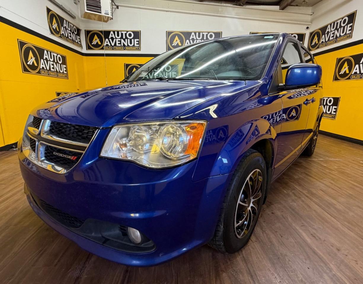 This exceptional example of a 2018 Dodge Grand Caravan SXT Premium Plus V6 is proudly offered by Auto Avenue Airdrie. <br/> This versatile and family-friendly minivan delivers the perfect combination of practicality, comfort, and performance. Designed to meet the demands of everyday life, the Dodge Grand Caravan offers a spacious interior, flexible seating, and thoughtful features that make every journey enjoyable. With its proven V6 engine, you can count on reliable power and smooth performance whether youre commuting in the city or heading out on a road trip. <br/> Equipped with a backup camera, this Grand Caravan enhances your confidence and safety while maneuvering in tight spaces. Its user-friendly design and dependable build quality ensure peace of mind for you and your passengers every time you get behind the wheel. <br/> Well-loved for its versatility and value, this Dodge Grand Caravan SXT Premium Plus stands out as an ideal choice for families and individuals alike. This is more than just a vehicle &mdash; it&rsquo;s the perfect companion for all of life&rsquo;s journeys.<br /><br />AUTO AVENUE IS AN AMVIC LICENSED DEALERSHIP, COMMITTED TO PROVIDING EXCEPTIONAL SERVICE AND QUALITY VEHICLES WITH FLEXIBLE PAYMENT OPTIONS. <br/>