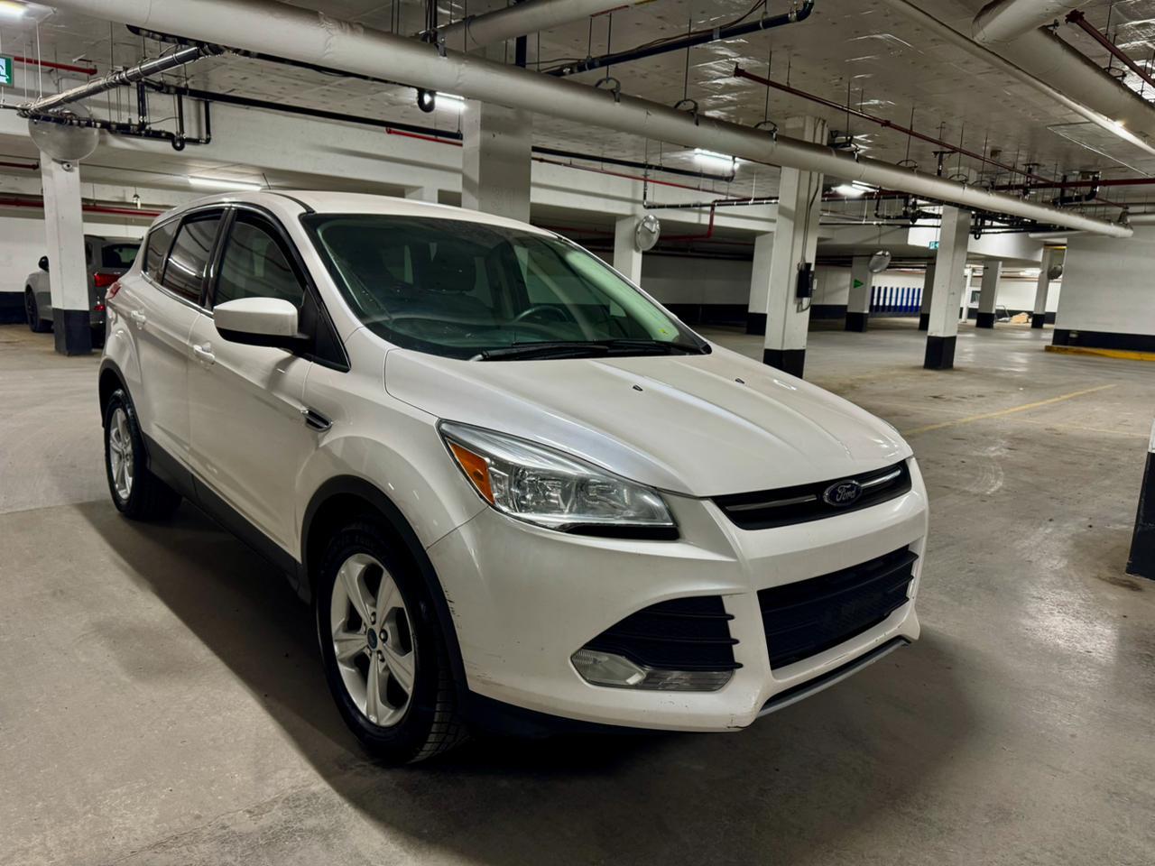 <p>Looking for a reliable and versatile SUV thats perfect for navigating Canadian roads? Check out this pre-owned 2014 Ford Escape SE, now available at MA Capital Automotive! This well-maintained Escape offers a comfortable and practical driving experience, ideal for daily commutes, weekend getaways, and everything in between. With its efficient gasoline engine and smooth automatic transmission, youll enjoy a responsive and enjoyable ride. This Escape has 187,000km on the odometer.</p><p>The 2014 Ford Escape SE provides a spacious interior, offering ample room for passengers and cargo. Its front-wheel drive configuration delivers confident handling in various driving conditions. This SUV is a great choice for those seeking a balance of style, functionality, and fuel efficiency.</p><p>Here are five standout features of this 2014 Ford Escape SE that will make you want to get behind the wheel:</p><ul><li><strong>Fuel-Efficient Performance:</strong> Enjoy a great balance of power and economy, saving you money at the pump.</li><li><strong>Spacious Interior:</strong> Plenty of room for passengers and all your gear, making every trip a comfortable one.</li><li><strong>Automatic Transmission:</strong> Experience effortless driving with smooth gear changes.</li><li><strong>Versatile SUV Design:</strong> Perfect for both city driving and weekend adventures.</li><li><strong>Reliable Ford Build:</strong> Benefit from Fords reputation for durability and dependability.</li></ul><p><strong><em>Powered by AutoIntelligence&trade;</em></strong> Vehicle information has been generated using artificial intelligence and is provided for informational purposes only. While efforts are made to ensure accuracy, please confirm all details directly with the dealer.</p>