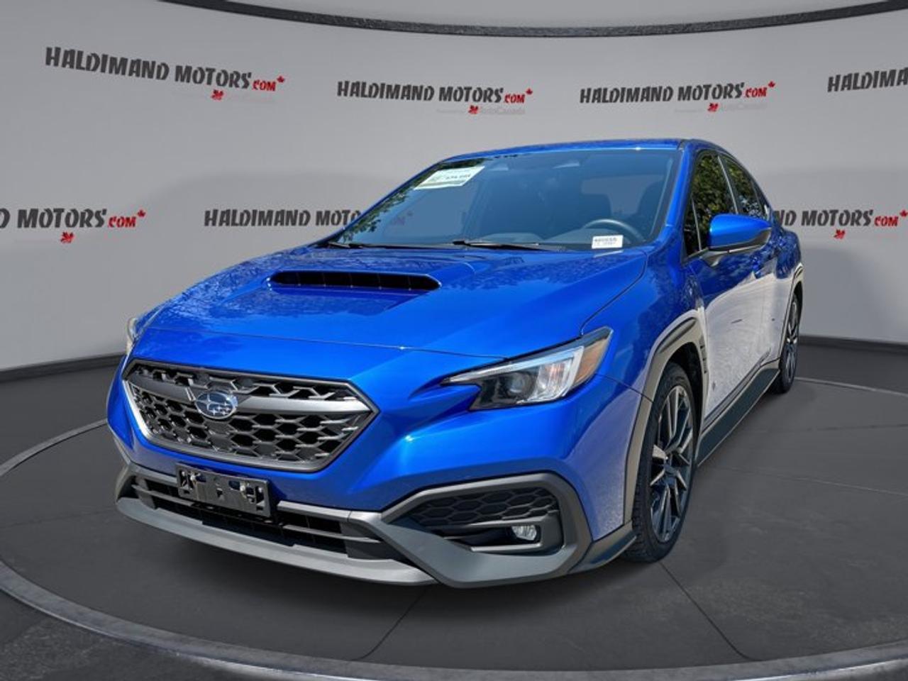 // ACCIDENT FREE!! //<br /><br />This 2023 Subaru WRX Sport is a sharp sport sedan built to make every drive feel special. It comes finished in Blue with a Black interior, 4 doors, and only 19,950 km. With its 2.4-litre gas engine, CVT, and accident-free history, this used WRX Sport delivers confidence, comfort, and real everyday excitement.<br /><br />At Haldimand Motors Ltd. in Cayuga, this 2023 Subaru WRX Sport blends rally-inspired character with modern features drivers want most. The sunroof adds open-air enjoyment, while heated front seats, dual-zone climate control, and smartphone integration help make daily travel easy. Its rear spoiler, LED headlamps, and performance tires give this sedan a focused look and feel.<br /><br />FEATURES OF THE WRX Sport | No Accidents<br />   2.4-litre turbocharged Boxer engine performance<br />   Sport-tuned sedan with confident road manners<br />   CVT with dual shift mode control<br />   Sunroof and rear spoiler add appeal<br /><br />ADVANCED SAFETY FEATURES<br />   Backup camera helps with reversing confidence<br />   Blind spot monitor adds lane-change awareness<br />   Adaptive cruise control supports highway driving<br />   Side and head airbags enhance protection<br /><br />PERFORMANCE AND EFFICIENCY<br />   2.4-litre gas engine delivers eager response<br />   CVT supports smooth and steady power<br />   Dual shift mode adds manual control<br />   Performance tires enhance grip and handling<br /><br />COMFORT AND CONVENIENCE<br />   Heated front seats for cold mornings<br />   Dual-zone climate control improves cabin comfort<br />   Power driver seat with lumbar support<br />   Push button start adds daily ease<br /><br />TECHNONOLGY AND CONNECTIVITY<br />   Apple CarPlay keeps apps within reach<br />   Android Auto adds simple phone integration<br />   Bluetooth integration supports hands-free communication<br />   Steering wheel audio controls aid focus<br /><br />CARGO SPACE<br />   Rear trunk access makes loading simple<br />   Remote trunk release adds quick convenience<br />   Sedan trunk suits daily gear well<br />   Spare tire offers added peace<br /><br />AWARDS & RECOGNITIONS<br />   Top Safety Pick, Insurance Institute for Highway Safety, 2023<br /><br />WHAT OTHER OWNERS LIKE<br />   Strong turbo power for everyday driving<br />   Secure handling in varied road conditions<br />   Comfortable ride with sporty character<br />   Easy smartphone connectivity and useful technology<br /><br />This 2023 Subaru WRX Sport offers a great balance of fun and function. The turbocharged 2.4-litre engine gives this sedan lively power, while power steering and stability control help it feel composed in town and on the highway. Anti-Lock Braking System, automatic headlights, fog lights, and a backup camera also help support confident driving.<br /><br />Inside, this 2023 Subaru WRX Sport keeps things practical and driver-focused. You get front air conditioning, automatic climate control, an adjustable steering wheel, a leather-wrapped steering wheel, and ambient lighting for a refined feel. Heated mirrors, power mirrors, power windows, rear window defroster, and automatic door locks add welcome convenience throughout the year.<br /><br />This 2023 Subaru WRX Sport also brings comfort for daily use with thoughtful details. The driver benefits from a power seat, lumbar support, illuminated vanity mirror, and easy access to key controls. Passengers will appreciate the roomy 4-door layout, passenger airbag sensor, child safety locks, and the clean, sporty cabin finished in Black.<br /><br />For drivers who want a sedan that feels engaging but still works well every day, this 2023 Subaru WRX Sport is an easy choice. Its accident-free history, low kilometre reading, practical trunk, and strong list of must-have features make it a smart pick for commuting, weekend drives, and year-round enjoyment in Cayuga and beyond.<br /><br />This 2023 Subaru WRX Sport | No Accidentss VIN is: JF1VBAH60P8809983.<br /><br />WHY CHOOSE US? <br /><br />Honest & Transparent Buying Experience: Weve been a trusted name in business since 1984.<br /><br />STRAIGHTFORWARD PRICING:<br />Our Advertised Price Includes:<br />>>Safety Certification (No separate fee!)<br />>>30-Day 100% Mechanical Warranty<br />>>FREE Carfax History Report.<br />>>No upcharge for paying cash.<br />(Prices Exclude HST and Licensing Fees only.)<br /><br />>>Browse 300+ vehicles all in ONE LOCATION<br /><br />EASY FINANCING: Great rates & open loans<br /><br />WE BUY CARS: Get Top Dollar for your trade-in, or sell us your vehicle for CASH! Even if you dont buy from us!<br /><br />STOP BY TODAY<br />Treat yourself - stop by Haldimand Motors Ltd. located at 42 Talbot St E, Cayuga, ON N0A 1E0 to make this car yours today!<br /><br />https://www.haldimandmotors.com/used/stock-460555.html