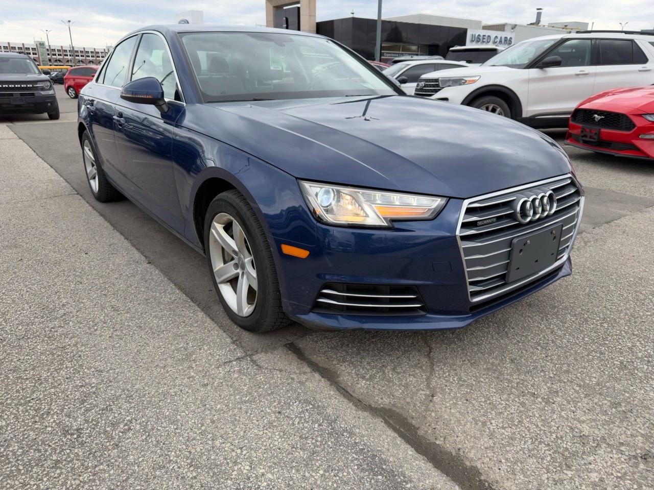 <b>OEM OPTIONS: </b>MOONLIGHT BLUE METALLIC ,  BLACK LEATHER SEAT TRIM ,  WHLS 8J X 18 10-SPOKE DYNAMIC DESIGN<br><br><b>PERFORMANCE & CAPABILITY: </b>Priority Inventory Alert! This highly anticipated <b>2017 Audi A4 2.0T Komfort</b> finished in Moonlight Blue Metallic with a Black, Leather Seat Trim interior, creating a cool, confident, and deep visual. The classic Sedan body style provides a comfortable ride, good fuel efficiency, and a sleek profile suitable for daily driving. Powered by a responsive <b>2.0L 4cyl</b> engine paired with a smooth <b>7 Speed Automatic with Auto-shift</b> and a confident <b>AWD</b> system.<br><br><b>MODEL REVIEWS: </b>Renowned for its impeccable high-quality interior, refined and quiet ride, standard Quattro all-wheel drive, and advanced MMI tech. The <b>All-Wheel Drive</b> system provides enhanced traction and stability, offering confident handling in all weather conditions.<br>Powered by a versatile <b>2.0L 4cyl</b>, offering a great balance of performance and fuel efficiency. The <b>7-Speed Automatic</b> transmission with <b>Auto-shift</b> gives you the best of both worlds: effortless automatic driving and the option for manual control for a sportier feel.<br><br><b>EQUIPMENT: </b><br><b>Safety & Driver Assistance:</b> PANIC ALARM, TRACTION CONTROL, ABS BRAKES, ANTI-WHIPLASH FRONT HEAD RESTRAINTS, BRAKE ASSIST, DUAL FRONT IMPACT AIRBAGS<br><b>Comfort & Convenience:</b> POWER PASSENGER SEAT, ILLUMINATED ENTRY, PASSENGER VANITY MIRROR, REMOTE KEYLESS ENTRY, OVERHEAD CONSOLE, POWER WINDOWS<br><b>Technology & Entertainment:</b> TRIP COMPUTER, RADIO DATA SYSTEM, TACHOMETER, CD PLAYER, DIVERSITY ANTENNA, OUTSIDE TEMPERATURE DISPLAY<br><b>Performance & Capability:</b> FOUR WHEEL INDEPENDENT SUSPENSION, FRONT ANTI-ROLL BAR, REAR ANTI-ROLL BAR, SPEED-SENSING STEERING<br><b>Exterior & Styling:</b> ALLOY WHEELS, REAR FOG LIGHTS, DELAY-OFF HEADLIGHTS, FRONT FOG LIGHTS, PERIMETER/APPROACH LIGHTS, POWER MOONROOF<br><br><b>Its a perfect day for a test drive!</b> Visit us to see this Audi A4 in person.<br><br><p> </p>

<h4>INCOMING USED VEHICLE</h4>

<p><em>This vehicle is an incoming trade-in and will be arriving soon! Contact us to be notified when it arrives.<br>
<br>
<strong>Representative image. </strong>Actual vehicles colour, options, and condition <strong>may differ.</strong></em></p>

<p>BUY WITH COMPLETE CONFIDENCE</p>

<p>
- AutoIQ Exclusive Pre-Owned Program<br>
- Shop online or in-store, any way you want it<br>
- Virtual trade estimate & appraisal<br>
- Virtual credit approval & eSignature
</p>

<p>The AutoIQ Dealership Group came together in 2016 with a mission to deliver an exceptional car-buying experience. With 8 dealerships across Ontario, offering 13 brands and over 1500 vehicles in stock, AutoIQ customers can expect great selection, value, and trust. Buying a new vehicle is a significant purchase, and we want to ensure that you LOVE it! Whether you are purchasing a new or quality pre-owned vehicle from us, we offer attractive financing rates and flexible terms, regardless of your credit.</p>

<p>SPECIAL NOTE: This vehicle is reserved for AutoIQs retail customers only. Please, no dealer calls. Errors and omissions excepted.</p>

<p>*As-traded, specialty or high-performance vehicles are excluded from the 7-Day Money Back Guarantee Program (including, but not limited to Ford Shelby, Ford mustang GT, Ford Raptor, Chevrolet Corvette, Camaro 2SS, Camaro ZL1, V-Series Cadillac, Dodge/Jeep SRT, Hyundai N Line, all electric models)</p>