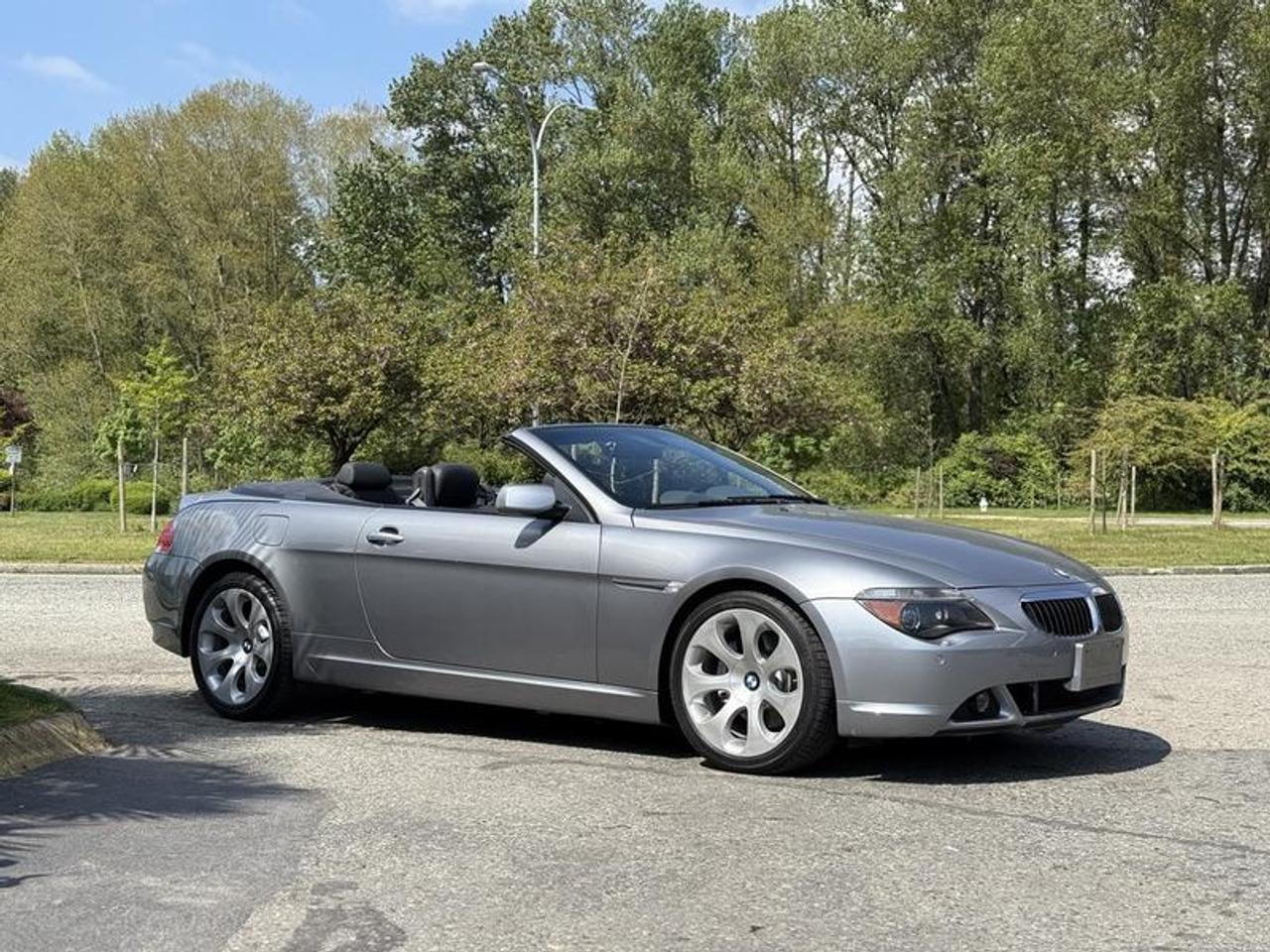 This 2004 BMW 645Ci Convertible is powered by a 4.4L N62 V8 paired with a 6-speed ZF automatic transmission and rear-wheel drive, delivering refined performance in a grand touring convertible package. It features adaptive headlights with auto-leveling and high-pressure washers, along with leather upholstery, power-adjustable heated front sport seats, and driver memory functions for added comfort.

Additional equipment includes BMWs iDrive infotainment system, a premium AM/FM stereo system with 8 speakers and dual subwoofers, dual-zone automatic climate control, parking distance sensors, 4-wheel ABS, and power windows, power door locks, and power mirrors. Finished in silver with a black leather interior, this 2-door convertible offers a combination of luxury, performance, and open-top driving enjoyment. This item is currently OFFSITE. You must register an appointment with our office to schedule an offsite viewing. Appointments must be made a minimum of one business day in advance (and as defined by the days that Repo.com is open for business) before your appointment can be scheduled and confirmed. We may, at our own discretion, instead opt to transport smaller items to Repo.coms main yard for viewing purposes.  $18,890.00 plus $375 processing fee, $19,265.00 total payment obligation before taxes.   Listing report, warranty, contract commitment cancellation fee. All above specifications and information is considered to be accurate but is not guaranteed and no opinion or advice is given as to whether this item should be purchased. We do not allow test drives due to theft, fraud, acts of vandalism and undetectable impaired driving. Instead we provide the following benefits: Complimentary Warranty (with options to extend), Limited Money Back Satisfaction Guarantee on Fully Completed Contracts, Contract Commitment Cancellation, and an Open-Ended Sell-Back Option. Ask seller for details or call 604-522-REPO(7376) to confirm listing availability.