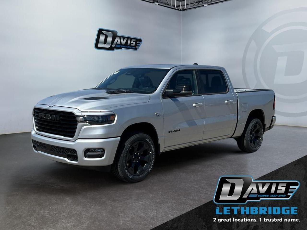 <b>Navigation, Apple CarPlay, Android Auto, 360 Camera, Heated Seats!</b><br /> <br /> <br /> <br />Built tough yet crafted for comfort, the 2026 Ram 1500 sets a new standard for modern pickup performance. <br /> <br />The Ram 1500's unmatched luxury transcends traditional pickups without compromising its capability. Loaded with best-in-class features, it's easy to see why the Ram 1500 is so popular. With the most towing and hauling capability in a Ram 1500, as well as improved efficiency and exceptional capability, this truck has the grit to take on any task.<br /> <br />This Silver Zynith Crew Cab 4X4 pickup has an Automatic transmission and is powered by a 395HP 5.7L 8 Cylinder Engine. <br /> <br /> Our 1500's trim level is Sport. This Ram 1500 in Sport trim rewards you with front heated seats, a leather-wrapped heated steering wheel, a 360 camera system, a 10-speaker Alpine audio, and a 12-inch infotainment screen with inbuilt navigation, Apple CarPlay and Android Auto, and 4G LTE Wi-Fi hotspot. Additional features include class IV towing equipment, aluminum wheels, power adjustable pedals, intersection collision assist, evasion assist, lane keep assist with lane departure warning, and even more! This vehicle has been upgraded with the following features: Navigation, Apple CarPlay, Android Auto, 360 Camera, Heated Seats, Heated Steering Wheel, Aluminum Wheels.<br /><br /> <br />To apply right now for financing use this link: <a href=https://lethbridge.davisdodge.ca/free-credit-check/ target=_blank rel=nofollow noopener noreferrer>https://lethbridge.davisdodge.ca/free-credit-check/</a><br /><br /> <br /><br />As a premier Chrysler, Dodge, Jeep and RAM dealership, Davis Dodge proudly offers an extensive selection of new and used vehicles to meet every drivers needs. Customers across Lethbridge, Fort Macleod, Taber, Claresholm, Coaldale, and beyond trust us for daily vehicle specials, certified service and parts, and a seamless online inventory experience. <br /><br /> With competitive financing options and expert support, we make car buying easy and enjoyable. <br /><br /> Ready to hit the road? Schedule your test drive today at Davis Dodge, your trusted Chrysler, Dodge, Jeep and RAM dealer in Lethbridge, Alberta.<br /><br /> Vehicle pricing offer shown expires 2026-05-31. <br /> Come by and check out our fleet of 60+ used cars and trucks and 100+ new cars and trucks for sale in Lethbridge. o~o