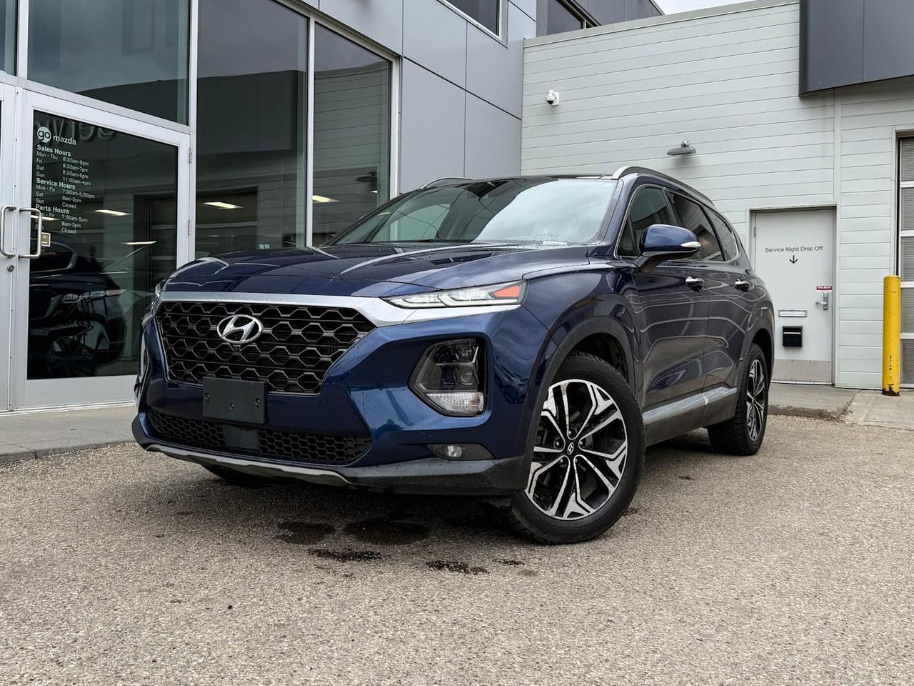 Experience luxury, performance, and advanced technology with this pre-owned 2019 Hyundai Santa Fe Ultimate 2.0T AWD in stunning Blue with Gray leather interior. Powered by a turbocharged 2.0L engine paired with an 8-speed automatic transmission, this SUV delivers a smooth yet exhilarating drive.Stay comfortable year-round with heated and ventilated front seats, dual-zone automatic climate control, and a panoramic sunroof. The Ultimate trim offers premium features including an Infinity audio system, navigation, and advanced safety with blind-spot detection, lane departure warning, and forward collision mitigation for peace of mind.With AWD, hill start assist, and electronic stability control, the Santa Fe is ready for any road condition. Luxury meets functionality with a power liftgate, smart key with push-button start, and multiple USB ports for seamless connectivity.Dont miss out on this well-equipped, stylish, and capable SUV. Visit us today at Go Mazda to test drive the 2019 Hyundai Santa Fe Ultimate 2.0T AWD  your perfect balance of power, comfort, and technology!Go Mazda is an AMVIC licensed businessThis vehicle has been registered in the province ofManitoba and is showing CarFax incidents in the amount of $2,197.20 and 2,197.21
