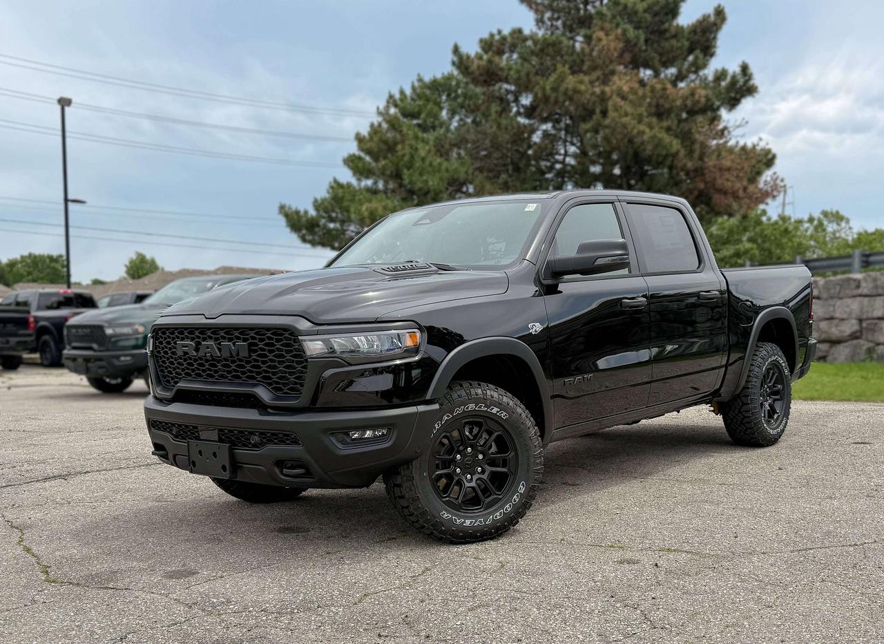 Bold and unmistakable, our New 2026 RAM 1500 Rebel Crew Cab 4X4 in Diamond Black Crystal Pearl stands out with aggressive design and off-road capability. Powered by a 5.7 Litre HEMI eTorque V8 and a 48V Mild-Hybrid system offering 395hp paired with an 8 Speed Automatic transmission engineered for off-road domination. A raised ride height, performance shocks, and a shift-on-demand transfer case can take this Four Wheel Drive truck further down the trail, and it achieves approximately 9.8L/100km on the highway. Our fierce and stylish RAM features LED lighting, fog lamps, a sport performance hood, bold graphics, bold alloy wheels, off-road fender flares, and robust skid plates.  Our Rebel cabin is ready for rough terrain thanks to its heated cloth front seats, eight-way power for the driver, a heated-wrapped steering wheel, dual-zone automatic climate control, 12V/115V outlets, a power rear window, and remote start. Off-Road Info Pages enhance the infotainment system, which bundles a 12-inch driver display, 12-inch touchscreen, full-color navigation, WiFi compatibility, Android Auto&reg;/Apple CarPlay&reg;, Bluetooth&reg;, voice control, and nine-speaker audio.  For safetys sake, RAM supplies front/rear auto braking, blind-spot monitoring, adaptive cruise control, active lane management, trailer sway damping, hill-start assistance, and more. Committed to truck leadership, our 1500 Rebel is a compelling choice! Save this Page and Call for Availability. We Know You Will Enjoy Your Test Drive Towards Ownership!