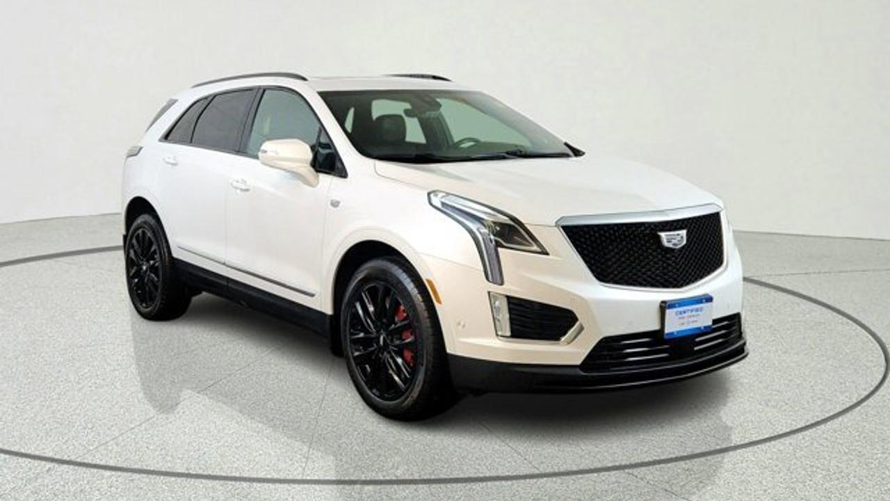 This 2022 Cadillac XT5 Sport delivers thrilling performance with its 3.6L V6 engine producing 310 horsepower and paired with a smooth 9-speed automatic transmission. All-wheel drive and performance suspension with real-time damping ensure sharp handling and stability, whether youre navigating Winnipegs winter roads or enjoying a weekend drive. Brembo brakes add confident stopping power, making it ideal for families or daily commuters who value sporty dynamics.Inside, you get premium comfort from heated leather front seats, a heated steering wheel, and dual-zone climate control. Tech stands out with an 8-inch touchscreen, wireless Apple CarPlay/Android Auto, Bose premium audio, and wireless charging. The panoramic sunroof floods the cabin with light, while power-folding mirrors and a hands-free liftgate make everyday tasks easier.Safety features help you drive worry-free, including forward collision alert, lane keep assist, blind-spot monitoring, and a rear vision camera. As a certified pre-owned vehicle, it has passed a 150+ point inspection, with roadside assistance and exchange privileges for added protection. Regular service records confirm its excellent condition.