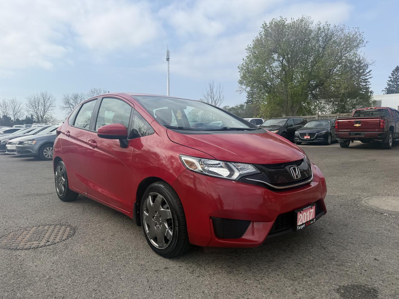 <p>Looking for a versatile and fun-to-drive vehicle that wont break the bank? Target Auto Centre has you covered with this vibrant red 2017 Honda Fit SE. Whether youre hauling groceries, sports equipment, or even a small piece of furniture, the flexible seating configurations make it incredibly adaptable to your lifestyle. This 2017 Honda Fit SE is perfect for city driving and weekend adventures alike. With only 106,078 kilometers on the odometer, its ready for many more miles of reliable service. The efficient I4 engine paired with a smooth Variable/CVT transmission ensures an enjoyable and economical driving experience, making it an excellent choice for navigating busy streets or cruising down the highway. Its sleek red exterior and comfortable black interior make it a stylish and practical option for anyone seeking a dependable compact car.&nbsp;</p><p>&nbsp;</p><p>This vehicle has a rebuilt title, therefore financing is not available.&nbsp;</p><p>&nbsp;</p><p><strong>CERTIFIED PRE-OWNED VEHICLE | BUY WITH CONFIDENCE</strong></p><p>&nbsp;- Ontario Safety Standards Certificate Included<br>- 30 Day / 1,000 KM Safety Warranty Included<br>- Fully Detailed Prior to Delivery<br>- CARFAX Vehicle History Report Available</p><p>&nbsp;</p><p><strong>VALUE AND TRANSPARENCY | WHY CHOOSE US</strong></p><p>- Price Plus HST & Licensing Only<br>- No Additional Fees | All-In Pricing<br>- Same Price Cash or Finance<br>- Extended Warranty Protection Plans Available<br>- Autotrader Best Priced Dealer Award (2024)<br>- Competitive Market Value on Trade-ins<br>- We&rsquo;ll Buy Your Car &mdash; No Purchase Required<br>- Know Someone Looking For a Vehicle? Get a Referral Award<br>- Open 7 Days a Week</p><p>&nbsp;</p><p>&nbsp;</p><p><strong>ABOUT TARGET AUTO CENTRE</strong></p><p>Target Auto Centre has been proudly serving London, Ontario and surrounding areas for over 20 years, offering over 150 quality pre-owned vehicles and a constantly updated selection to choose from. We focus on providing competitive pricing, clear information, and a straightforward buying process so you know exactly what to expect from start to finish.</p><p>Cars For Everyone! We offer a wide selection of vehicles to fit every lifestyle, need, and budget. Our inventory includes cars, trucks, SUVs, and vans from trusted brands such as Ford, Chevrolet, Toyota, Honda, Nissan, BMW, Mercedes-Benz, Audi, Lexus, Acura, Hyundai, Kia, Mazda, Volkswagen, Jeep, RAM, GMC, Subaru, and more. With new arrivals regularly, there&rsquo;s always something for everyone.</p><p>As a proud member of the Used Car Dealers Association of Ontario (UCDA), we are committed to operating with honesty, transparency, and professionalism in every transaction. Our goal is to make your vehicle purchase as simple and stress-free as possible, while delivering the level of service our customers continue to trust. Come visit us today and see why were the preferred choice for pre-owned vehicles in London and the surrounding areas. We look forward to earning your business!</p>