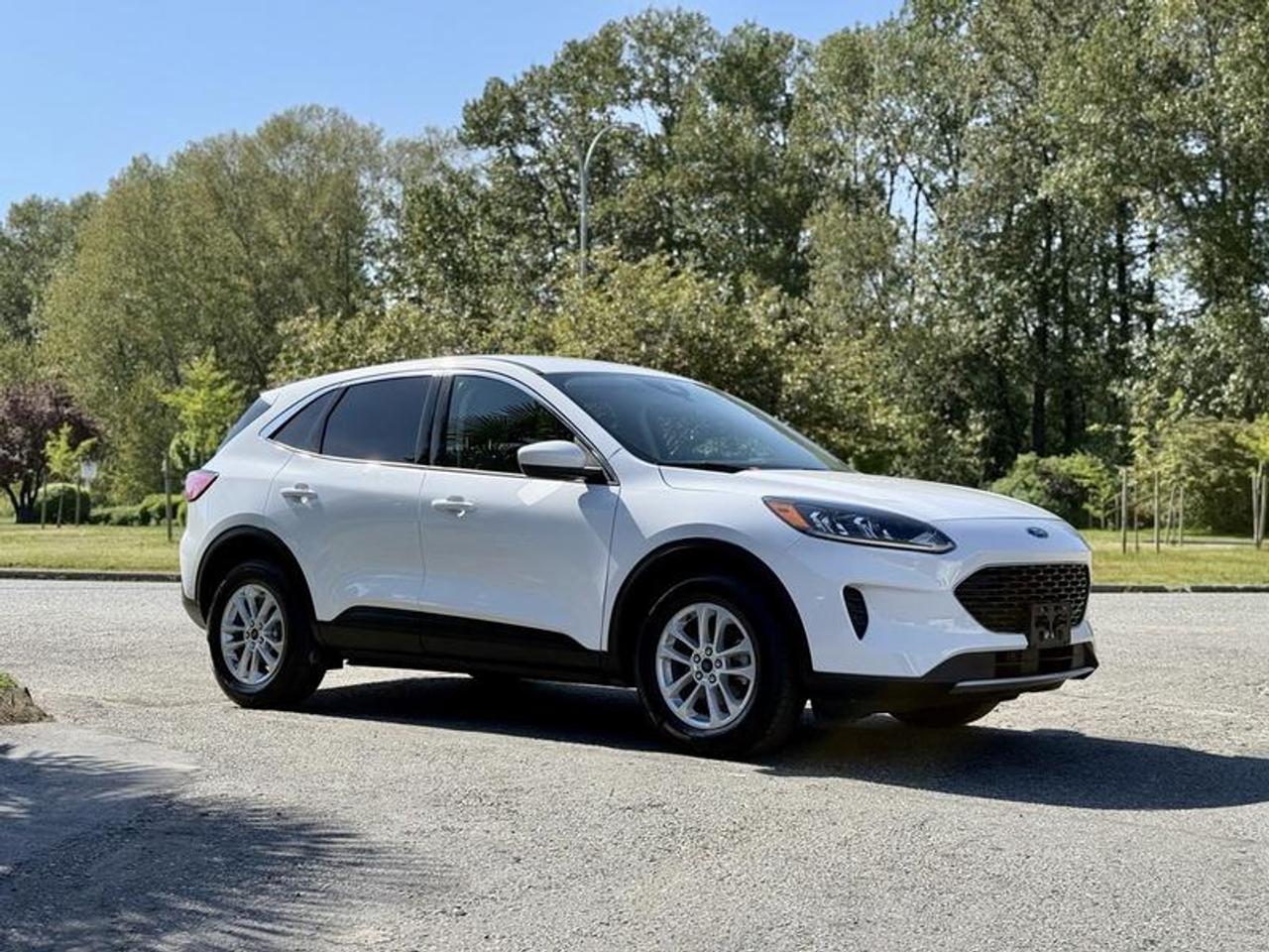 This 2020 Ford Escape SE AWD is powered by a 1.5L EcoBoost 3-cylinder engine paired with an 8-speed automatic transmission and all-wheel drive, offering an efficient and versatile setup for everyday driving. It features SYNC 3 infotainment with Apple CarPlay and Android Auto, heated front seats, cruise control, air conditioning and heat, Auto Hold, Auto Start-Stop, and selectable Eco Mode. Additional equipment includes 4-wheel ABS, AM/FM radio, power door locks, power windows, and power mirrors. Finished in white with a grey cloth interior, this compact SUV offers a comfortable and well-equipped driving experience suited for commuting, travel, or year-round use. This item is currently OFFSITE. You must register an appointment with our office to schedule an offsite viewing. Appointments must be made a minimum of one business day in advance (and as defined by the days that Repo.com is open for business) before your appointment can be scheduled and confirmed. We may, at our own discretion, instead opt to transport smaller items to Repo.coms main yard for viewing purposes.  $21,580.00 plus $375 processing fee, $21,955.00 total payment obligation before taxes.   Listing report, warranty, contract commitment cancellation fee, financing available on approved credit (some limitations and exceptions may apply). All above specifications and information is considered to be accurate but is not guaranteed and no opinion or advice is given as to whether this item should be purchased. We do not allow test drives due to theft, fraud, acts of vandalism and undetectable impaired driving. Instead we provide the following benefits: Complimentary Warranty (with options to extend), Limited Money Back Satisfaction Guarantee on Fully Completed Contracts, Contract Commitment Cancellation, and an Open-Ended Sell-Back Option. Ask seller for details or call 604-522-REPO(7376) to confirm listing availability.