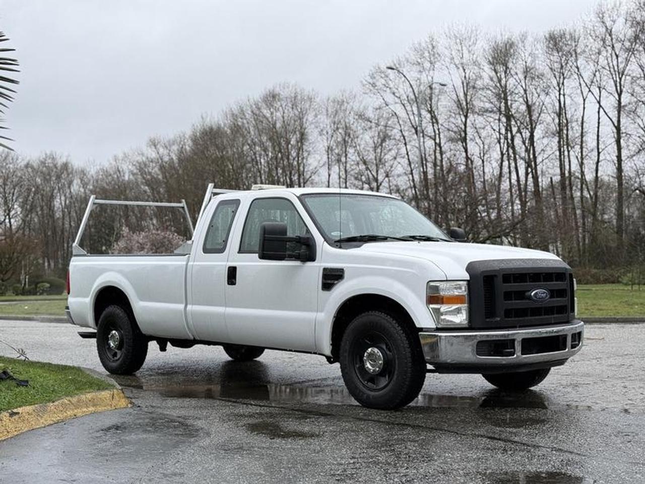 This 2008 Ford F-250 SD XL SuperCab pickup is powered by a 5.4L V8 paired with an automatic transmission and rear-wheel drive. Configured with a 8-foot long box, it features a trailer hitch receiver, trailer brake controller, wooden storage cabinets, air conditioning and heat, AM/FM radio, cruise control, 4-wheel ABS, and power windows. Finished in white with a beige vinyl interior, this Super Duty offers a practical and capable setup suited for work, hauling, or fleet use.  $18,850.00 plus $375 processing fee, $19,225.00 total payment obligation before taxes.   Listing report, warranty, contract commitment cancellation fee, financing available on approved credit (some limitations and exceptions may apply). All above specifications and information is considered to be accurate but is not guaranteed and no opinion or advice is given as to whether this item should be purchased. We do not allow test drives due to theft, fraud, acts of vandalism and undetectable impaired driving. Instead we provide the following benefits: Complimentary Warranty (with options to extend), Limited Money Back Satisfaction Guarantee on Fully Completed Contracts, Contract Commitment Cancellation, and an Open-Ended Sell-Back Option. Ask seller for details or call 604-522-REPO(7376) to confirm listing availability.
