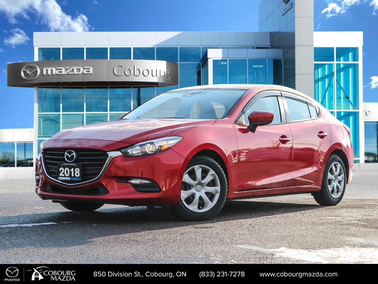<p>Experience the thrill of driving the 2018 Mazda Mazda3 GX, a stunning red sedan with a manual transmission and front-wheel drive for dynamic handling. This car offers an engaging drive, perfect for those who appreciate control and precision on the road.</p><p>The eye-catching red exterior is just the beginning. Step inside to find a sleek black interior that complements the modern and practical design of this compact sedan. Comfortable seating and user-friendly controls make for an enjoyable ride every time.</p><p>Stay confident and secure with features like brake assist, while keyless entry and power windows add convenience to your driving experience. With these thoughtful additions, the Mazda3 GX is designed to enhance your day-to-day commutes and weekend adventures alike.</p><p>This model is ideal for those who love a hands-on driving experience and value style and efficiency. Don't miss out on the opportunity to own a car that truly fits your lifestyle. Contact us today to learn more about the Mazda3 GX and how you can make it yours.</p>