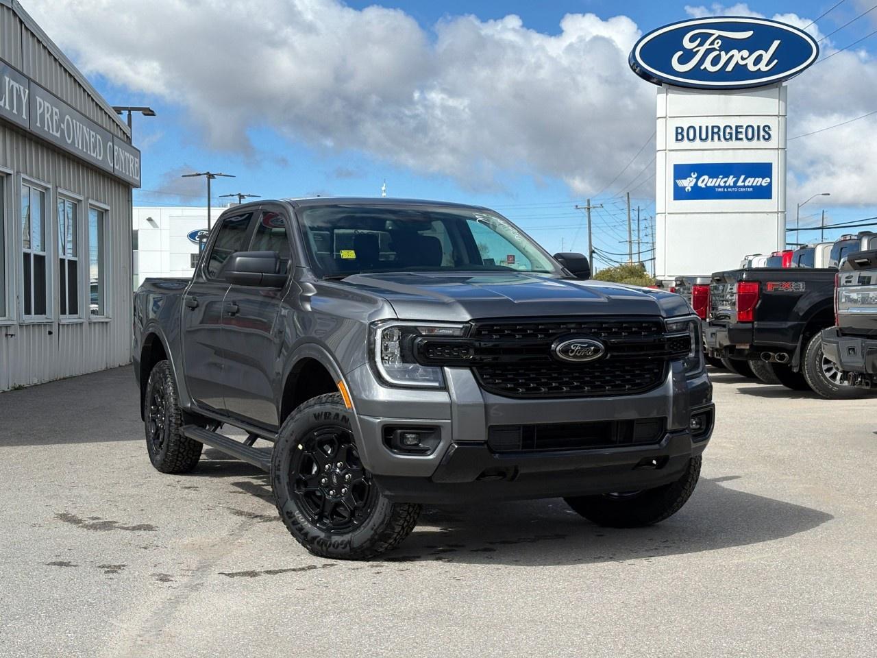 <p>The 2026 Ford Ranger XLT 4WD SuperCrew 5' Box in Carbonized Grey Metallic presents as a robust and reliable truck ready for adventure. With its advanced 4×4 drivetrain and intuitive handling drawn from selectable drive modes, this Ranger ensures a dynamic driving experience both on and off the road.</p><p>The exterior boasts a striking Black Appearance Package featuring 18" black painted and machined aluminum wheels, black rear bumper, and sleek body-colour painted front fascia. The black running boards add a touch of style and practicality, while the Tough Bed spray-in bedliner makes this truck ready for any challenge. Inside, enjoy the comfort of a black interior with leatherette features on the gear shifter and steering wheel, complemented by a tech-savvy cabin highlighted by a 12" Centre Display.</p><p>Tech enthusiasts will appreciate cutting-edge advancements such as the Dual-Zone Electronic Temperature Control, Pro Power Onboard  400W, and a wireless charging pad to keep devices powered on the go. Safety is a top priority with features like a backup camera, lane assist, parking sensors, and the Advanced Towing Package providing Pro Trailer Backup Assist, offering confident trailering capability.</p><p>For those who crave both adventure and modern convenience, this Ford Ranger is ideal. Its blend of power, style, and smart technology makes it perfect for active families or individuals who love the outdoors. Contact the dealership today to learn more and arrange a test drive.</p> <p><span style=color:rgb( 58 , 80 , 95 )>The discount shown on vehicle represents the </span><u>Cash Purchase</u><span style=color:rgb( 58 , 80 , 95 )> discount and is inclusive of all non-stackable and stackable cash purchase discounts from Ford of Canada and Bourgeois Motors Ltd. and is offered in lieu of sub-vented lease or finance rates. To get details on current discounts applicable to this and other vehicles in our inventory for Lease and Finance customer, see a member of our team. All offers for lease or finance are On Approved Credit (OAC).While every effort is made to ensure the accuracy of discounts and programs, programs are subject to change without notice </span><span style=color:rgb( 119 , 119 , 119 )>and may not be accurate or completely current. While every reasonable effort is made to ensure the accuracy of this data, we are not responsible for any errors or omissions contained on these pages.</span></p> <p><strong>Why Choose the Bourgeois Auto Group?</strong></p><p>For 80 years, Bourgeois Auto Group has been delivering exceptional automotive experiences. Our factor trained teams work to ensure you receive the shopping experience you deserve; whether you're looking for a new or new-to-you vehicle.</p><p>Shop 24/7 with our online showroom and chat service, ensuring convenience every step of the way. No hidden fees, full disclosure, and every pre-owned vehicle comes with a Carfax® report for peace of mind.</p><p>We offer a wide selection of pre-owned vehicles, all competitively priced using real-time market data. Get the best deal on your purchase and trade-in with our free Live Market Analysis report.</p><p>Looking to sell your car? We buy any make or modelno purchase required. Our simple to use online trade valuation tool will provide you with a clear, transparent selling experience whether you buy our car or not.</p><p>Backed by hundreds dedicated employees across 4 convenient locations, were here to meet all your automotive needs. Visit us in Midland or Parry Sound and explore our inventory or schedule your next service today.</p> <p><strong>Financing Your Next Vehicle with Bourgeois Motors Ford in Midland:</strong></p><p>At Bourgeois Motors Ford, we make financing your next vehicle simple and stress-free! Our team works with trusted lenders to find flexible options tailored to your budget. Drive away with confidenceapply today!</p><p>Take advantage of our online pre-qualification tool, backed by Equifax and TD Bank to find the payment that works for you. Simply <a href=https://www.bourgeoismotors.com/free-credit-check/ rel=nofollow><strong>CLICK HERE</strong></a><strong> </strong>to use our secure online credit tool with no impact to your credit.</p> <p><strong>This Is a Dealer Demonstrator. </strong>Experience exceptional value with Bourgeois Motors Fords executive demos. These are like-new vehicles with low mileage, premium features, and significant savings. Drive away with confidence, backed by the balance of factory warranties and our commitment to quality. Its a great way to own a new Ford.</p>