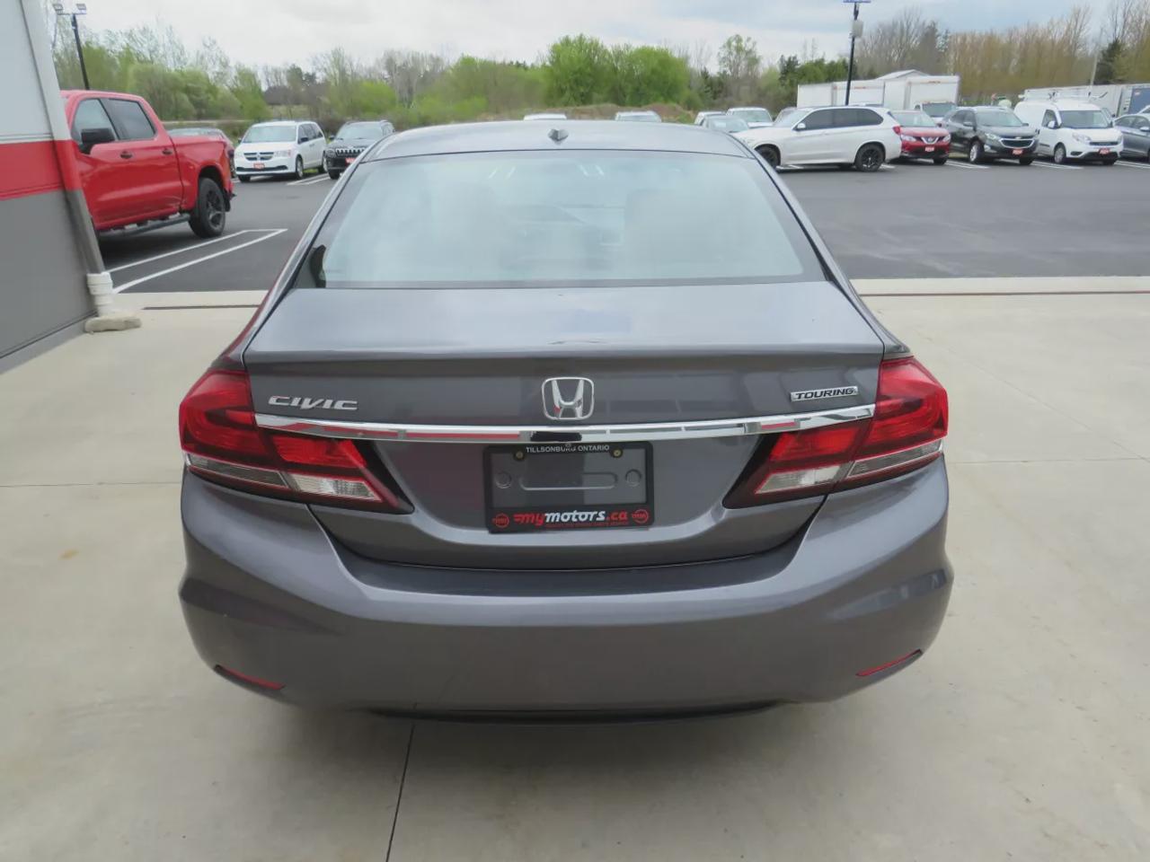 2014 Honda Civic Sedan Touring | Low KM!! | Alloy Rims | Leather | Sunroof | Navigation | Digital Touchscreen | CD Player | Reverse Camera | Photo