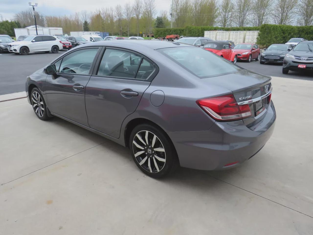 2014 Honda Civic Sedan Touring | Low KM!! | Alloy Rims | Leather | Sunroof | Navigation | Digital Touchscreen | CD Player | Reverse Camera | Photo