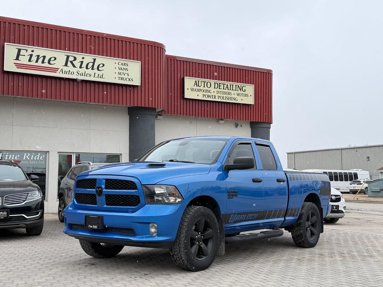 <p>2021 Ram 1500 Classic Express Quad Cab 4X4 Warlock Edition</p><p>3.6LTR V6<br>ONLY 105,000kms!<br>A/C<br>Tilt<br>Cruise<br>Power windows<br>Power locks<br>Power mirrors<br>Power seat (drivers)<br>Heated seats<br>Heated steering wheel<br>5 passengers<br>8.4 touch screen<br>AM/FM radio  /  U-Connect  /  Bluetooth<br>Apple Car play & Android Auto<br>Factory remote start<br>Back up camera<br>Paint to match front & rear bumpers<br>6.5ft box<br>Privacy glass<br>20 black aluminum wheels<br>Fog lights<br>NO CLAIMS!</p><p><strong>MORE PICTURES TO FOLLOW</strong></p><p>GVW: 6,800LBS<br>Gear ratio: 3.21<br>Transmission: 8 speed, 850RE<br>Towing: Approximately 6,000LBS</p><p>$31,975 Safetied<br>Financing and Warranty Available at Fine Ride Auto Sales Ltd<br>www.FineRideAutoSales.ca</p><p>Call: 204-415-3300 or 1-855-854-3300<br>Text: 204-226-1790<br>View in person at: Unit 3-3000 Main Street</p><p>DLR# 4614<br>**Plus applicable taxes**</p><p></p><p style=text-align:center;><span style=color:#000000;><i><span style=font-family:book antiqua, palatino, serif;font-size:14pt;><strong><u>***NEW SUMMER HOURS EFFECTIVE MAY 15, 2026***</u></strong></span></i></span></p><p style=text-align:center;><span style=color:#000000;><span style=font-family:book antiqua, palatino, serif;font-size:14pt;>Monday                9am to 6pm</span></span><br><span style=color:#000000;><span style=font-family:book antiqua, palatino, serif;font-size:14pt;>Tuesday               9am to 6pm</span></span><br><span style=color:#000000;><span style=font-family:book antiqua, palatino, serif;font-size:14pt;>Wednesday               9am to 8pm</span></span><br><span style=color:#000000;><span style=font-family:book antiqua, palatino, serif;font-size:14pt;>Thursday                9am to 6pm</span></span><br><span style=color:#000000;><span style=font-family:book antiqua, palatino, serif;font-size:14pt;>Friday                9am to 6pm</span></span><br><span style=color:#000000;><span style=font-family:book antiqua, palatino, serif;font-size:14pt;>Saturday                               CLOSED</span></span><br><span style=color:#000000;><span style=font-family:book antiqua, palatino, serif;font-size:14pt;>Sunday                                 CLOSED</span></span></p>